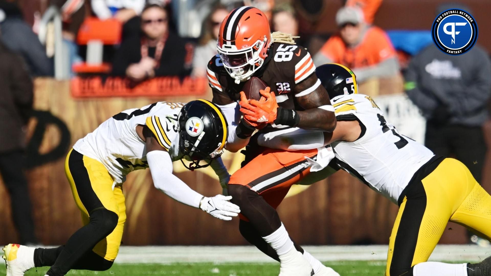 Pittsburgh Steelers safety Damontae Kazee (23) and linebacker Elandon Roberts (50) tackle Cleveland Browns tight end David Njoku (85) during the first half at Cleveland Browns Stadium.