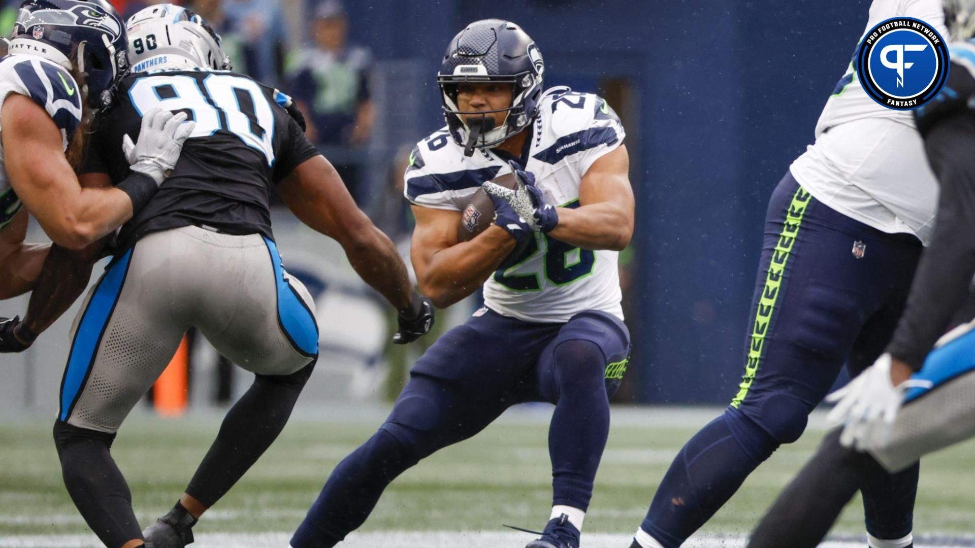 Zach Charbonnet (26) rushes against the Carolina Panthers during the fourth quarter at Lumen Field.