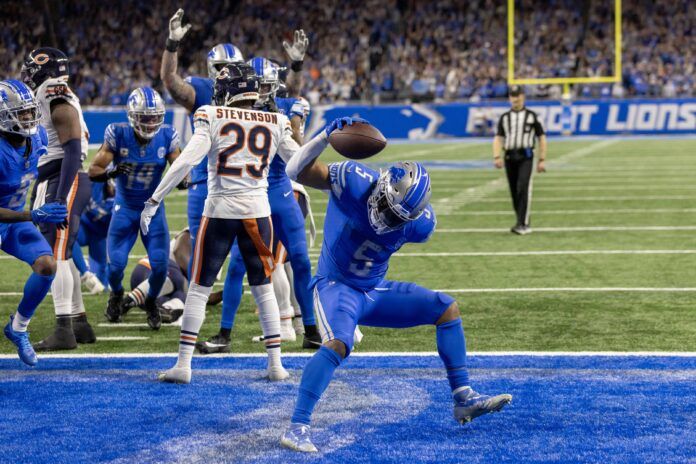 Detroit Lions running back David Montgomery (5) scores a touchdown against the Chicago Bears during the second half at Ford Field.