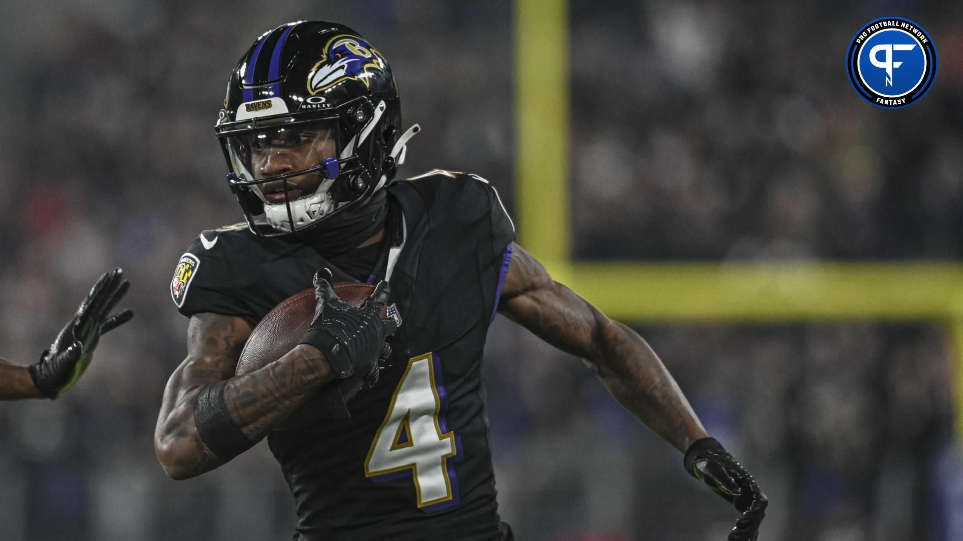Zay Flowers (4) runs after a first half catch against the Cincinnati Bengals at M&T Bank Stadium.