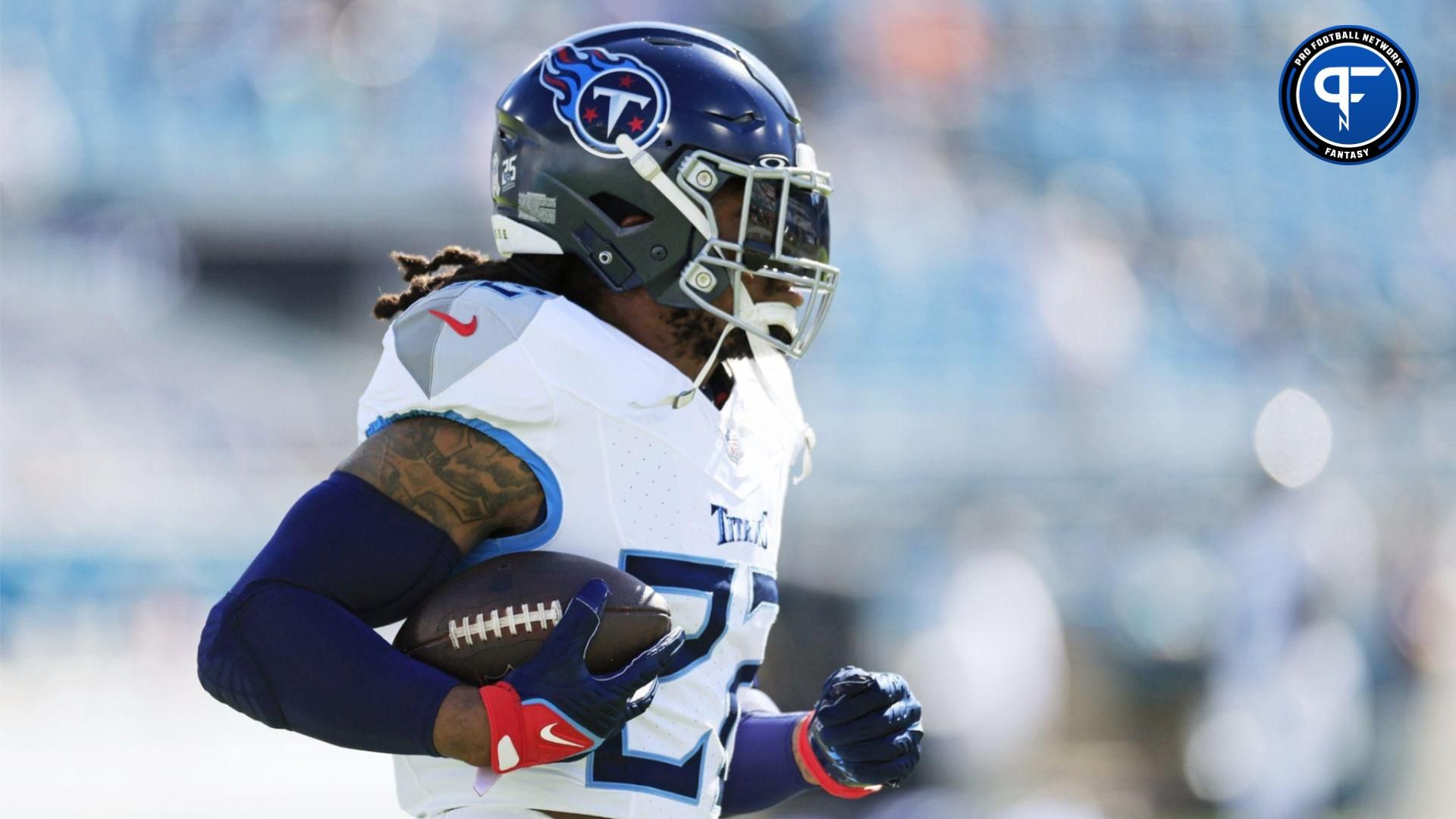 Tennessee Titans running back Derrick Henry (22) runs the ball before an NFL football matchup.