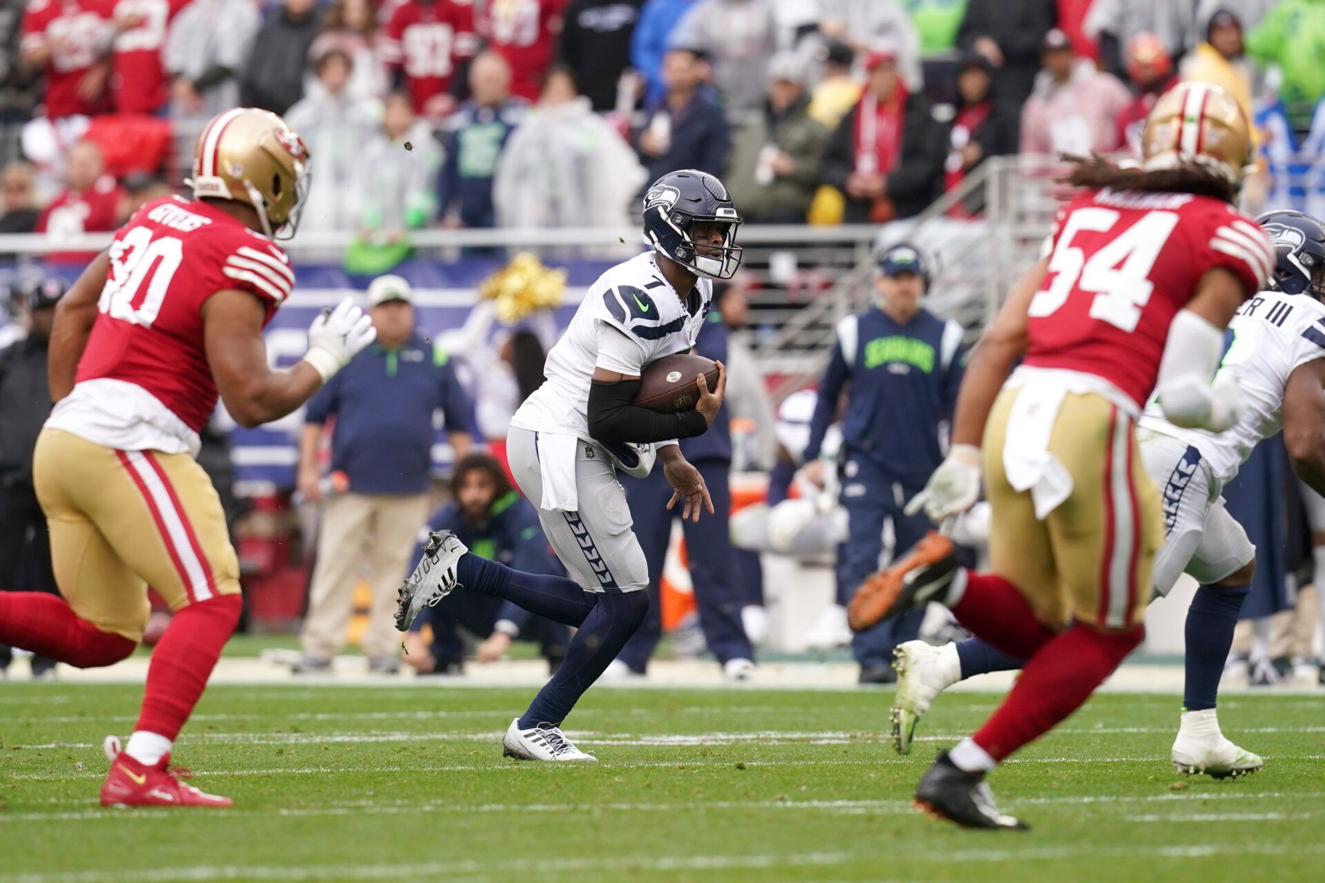 Seattle Seahawks quarterback Geno Smith (7) runs in the second quarter during a wild card game against the San Francisco 49ers at Levi's Stadium.