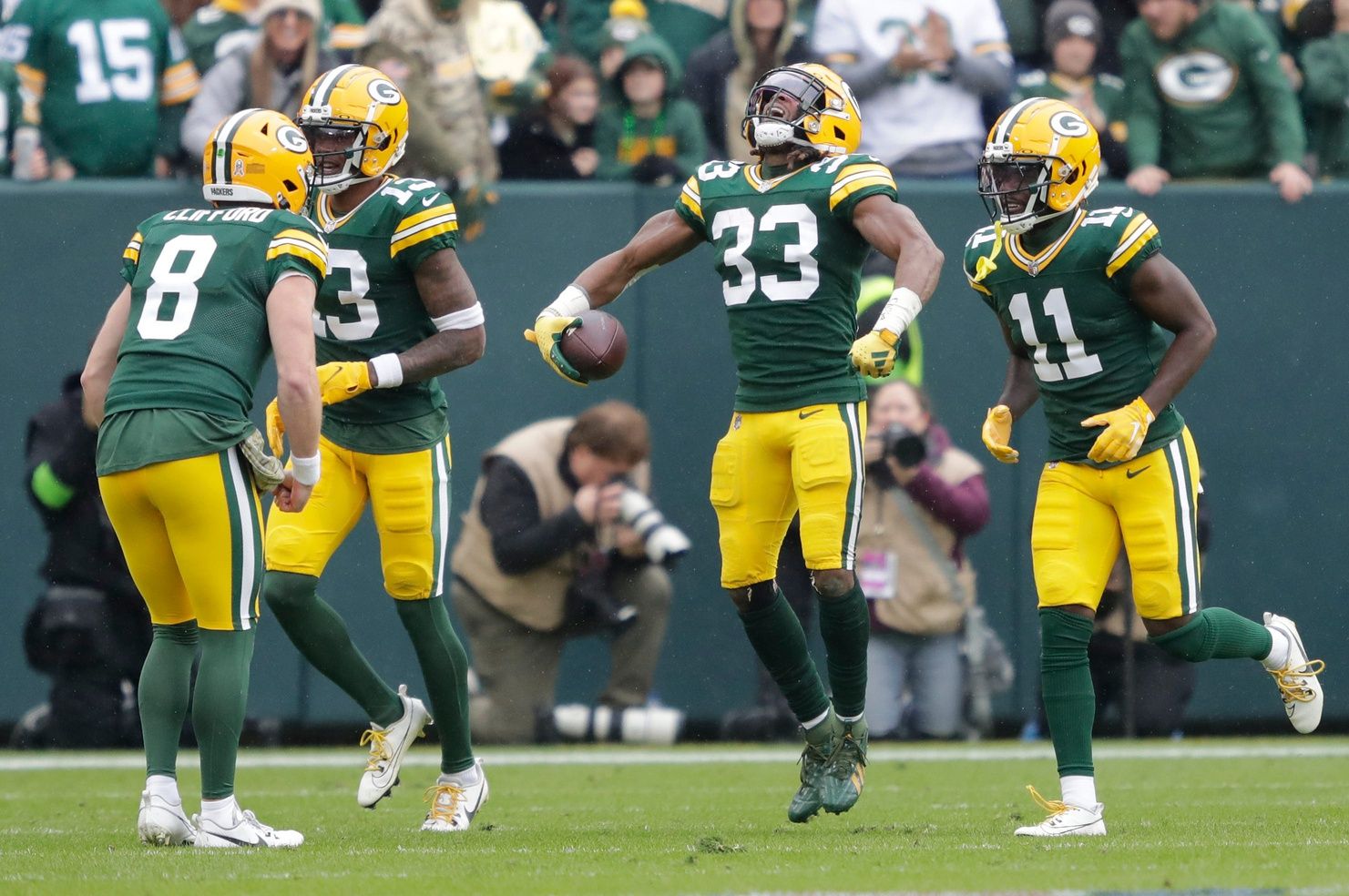 Green Bay Packers running back Aaron Jones (33) celebrates scoring a touchdown against the Los Angeles Rams during their football game Sunday, November 5, 2023, at Lambeau Field in Green Bay, Wis.