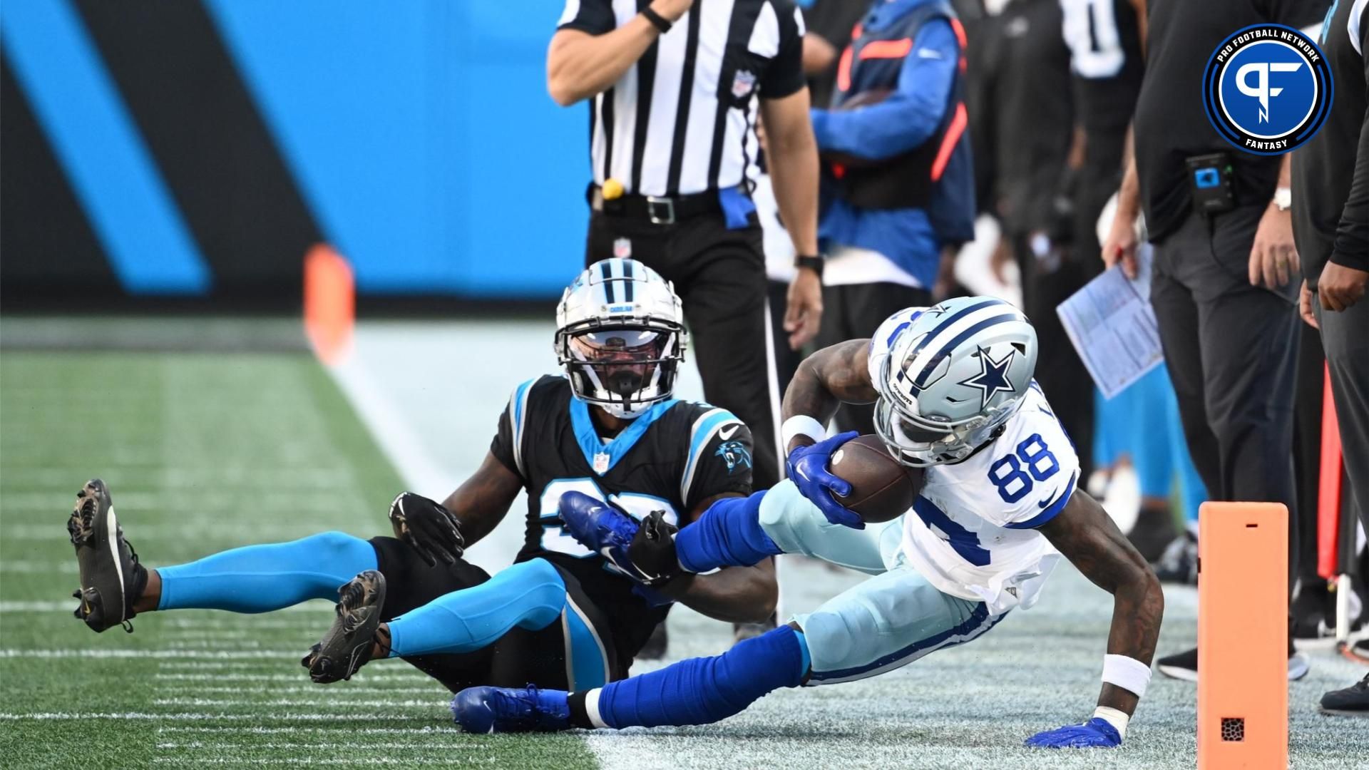 Dallas Cowboys wide receiver CeeDee Lamb (88) with the ball as Carolina Panthers cornerback Dicaprio Bootle (32) defends in the fourth quarter.