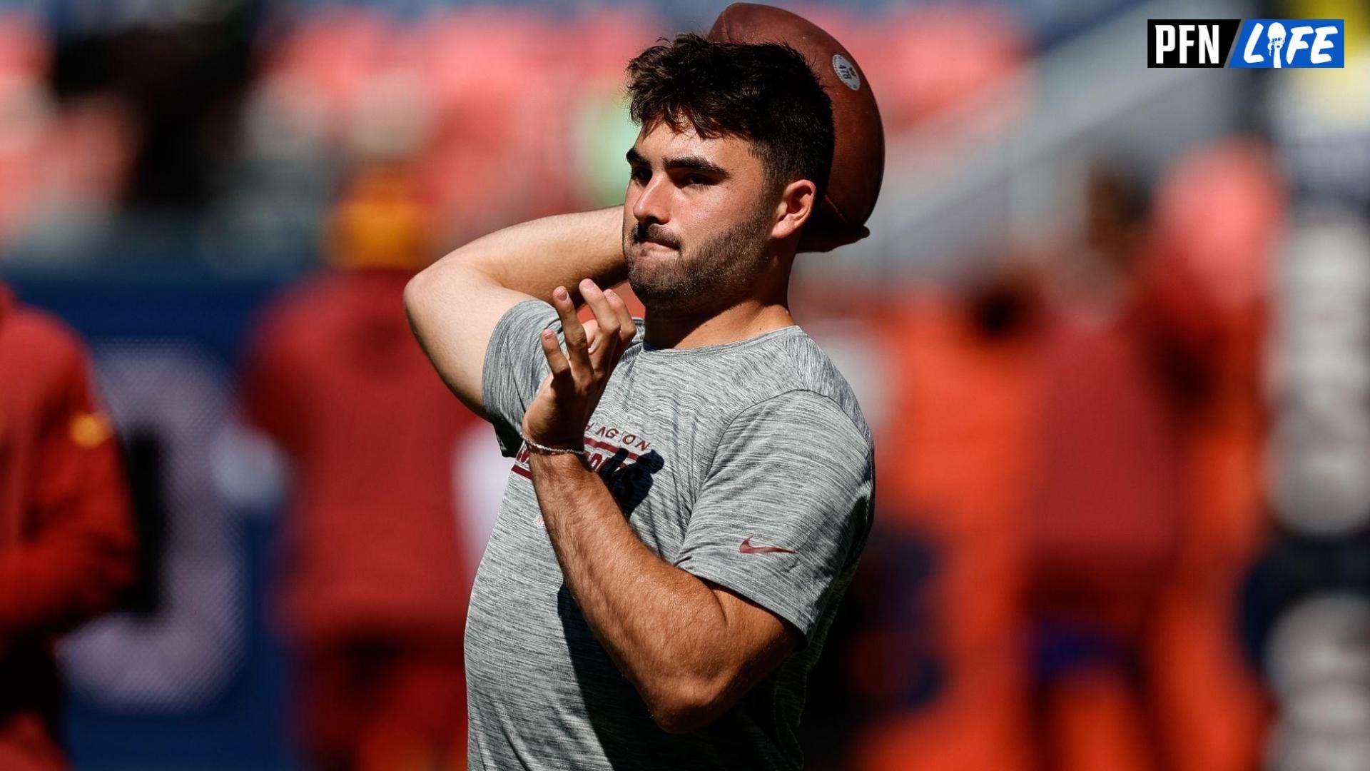 Sam Howell (14) before the game against the Denver Broncos at Empower Field at Mile High.