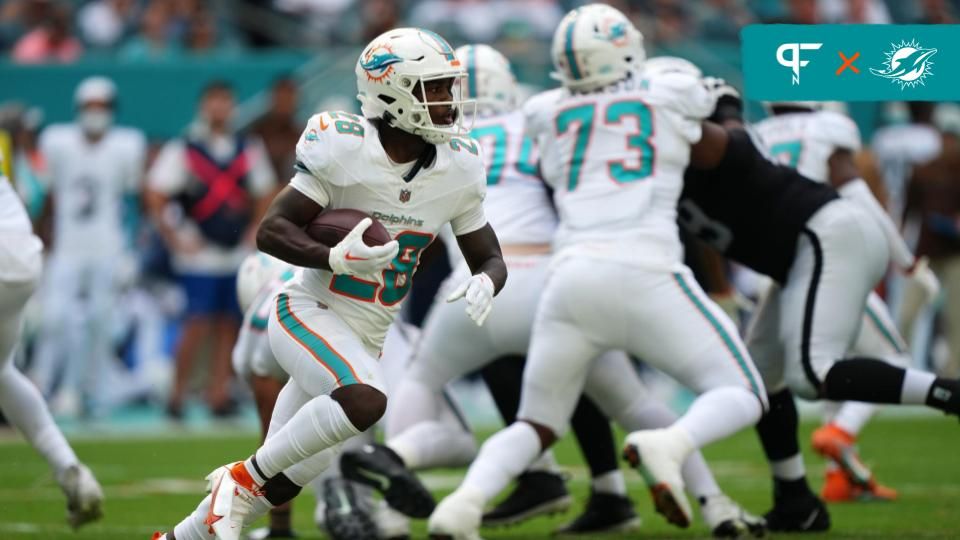 De'Von Achane (28) runs with the ball against the Las Vegas Raiders during the first half at Hard Rock Stadium.