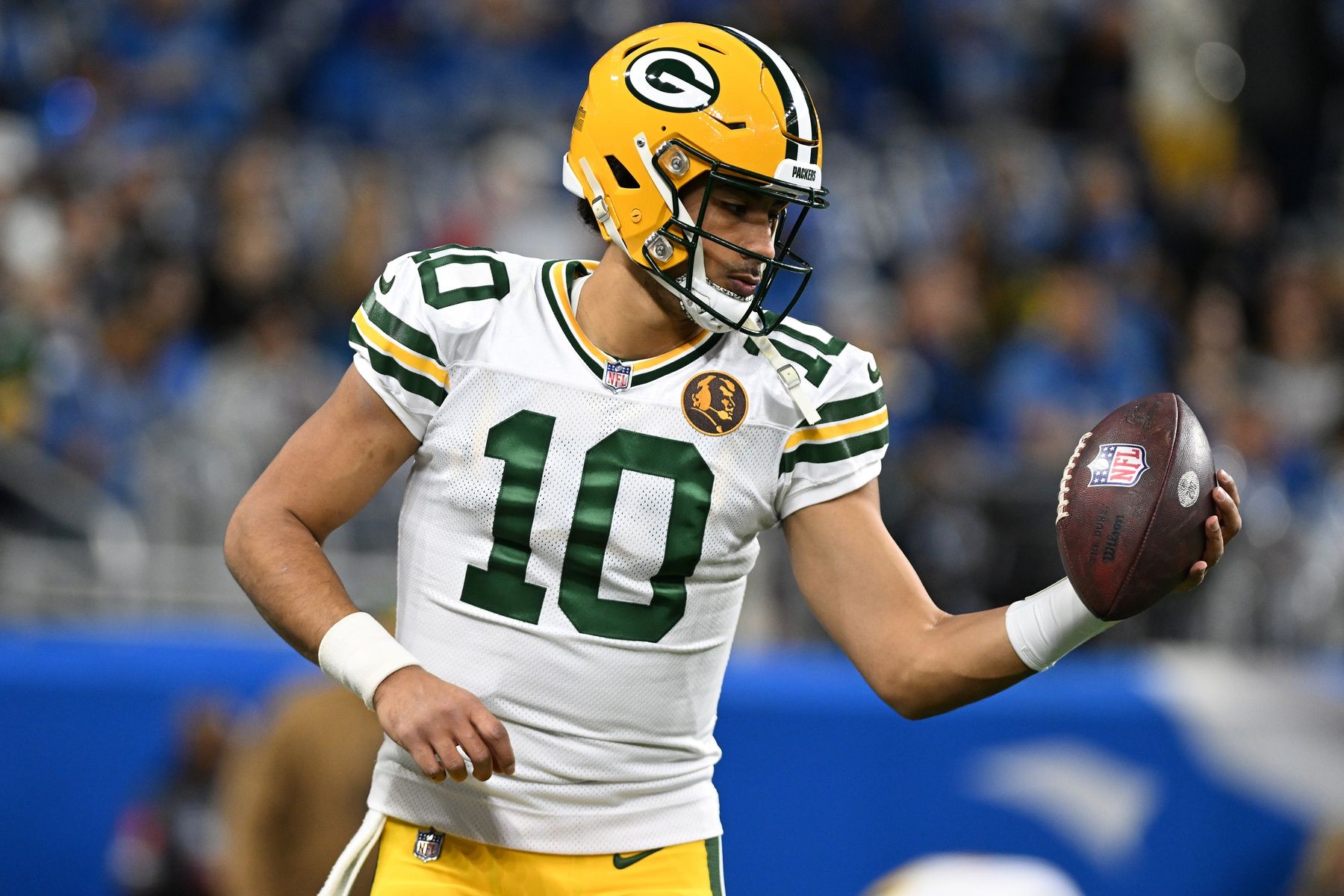 Green Bay Packers quarterback Jordan Love (10) warms up before their game against the Detroit Lions at Ford Field.