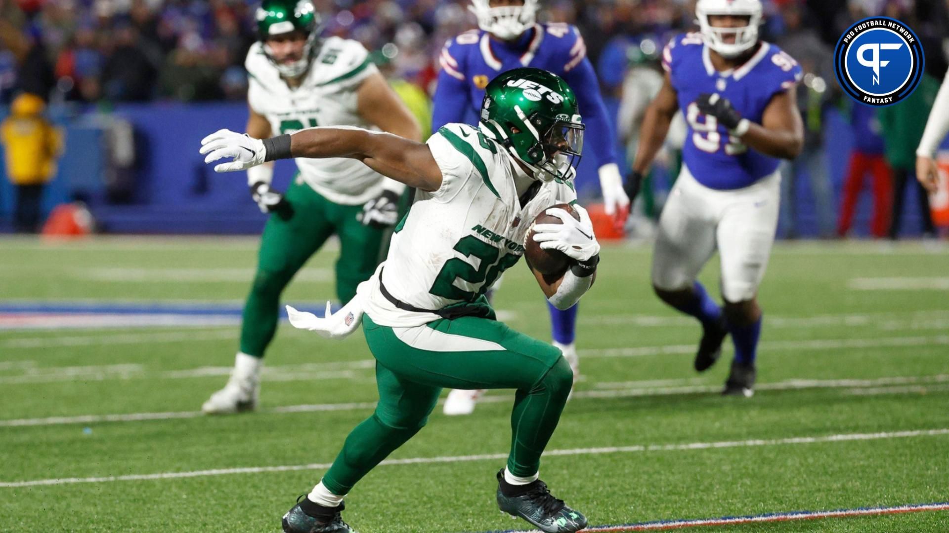 New York Jets running back Breece Hall (20) turns upfield after a catch.