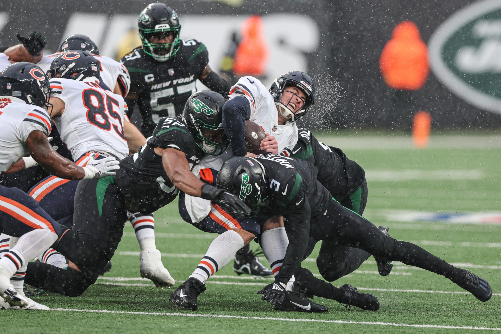 Chicago Bears quarterback Trevor Siemian (15) is tackled by New York Jets wide receiver Tarik Black (3) and defensive end Jermaine Johnson (52) during the first half at MetLife Stadium.