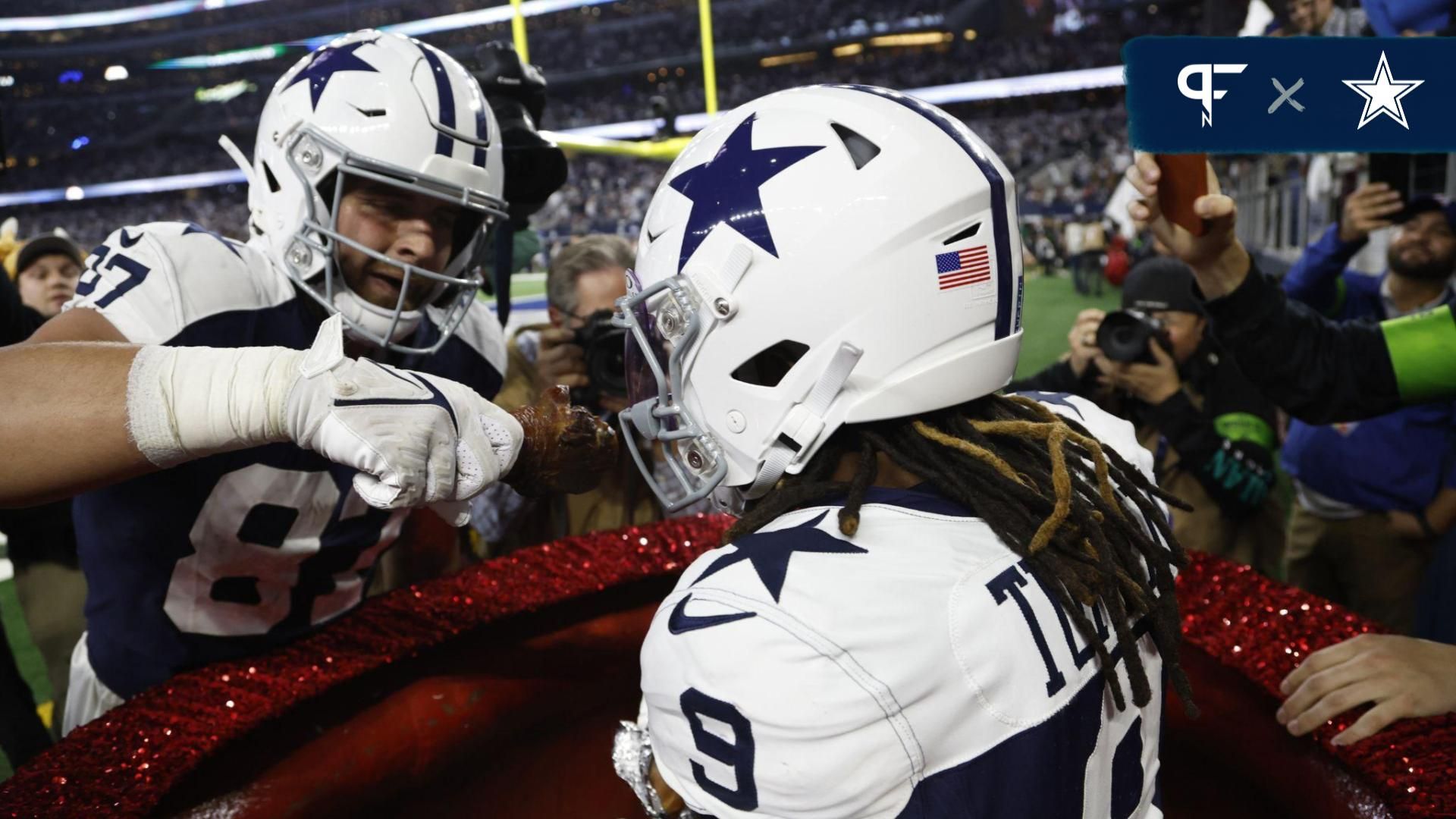 Dallas Cowboys wide receiver KaVontae Turpin (9) eats a turkey leg as tight end Jake Ferguson (87) feeds him.