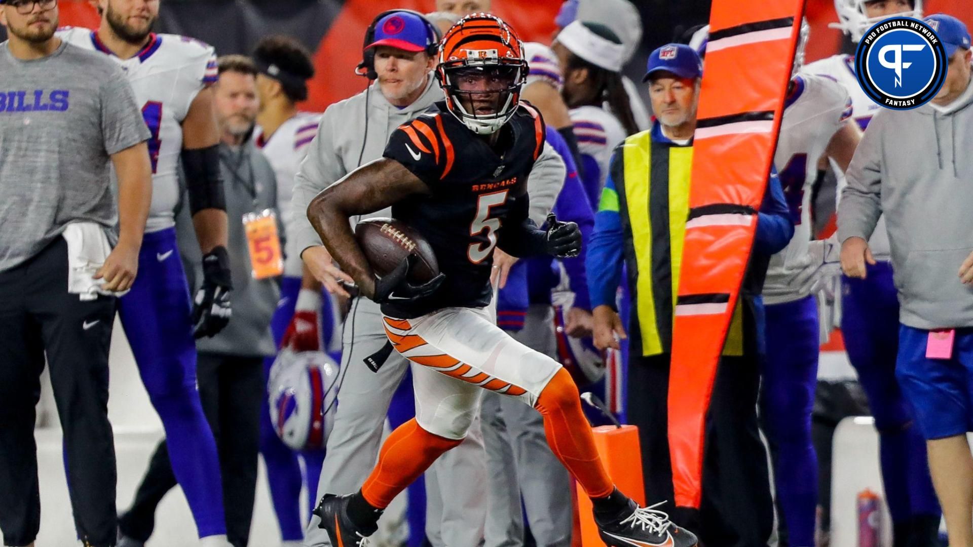 Cincinnati Bengals wide receiver Tee Higgins (5) runs with the ball against the Buffalo Bills in the first half at Paycor Stadium.