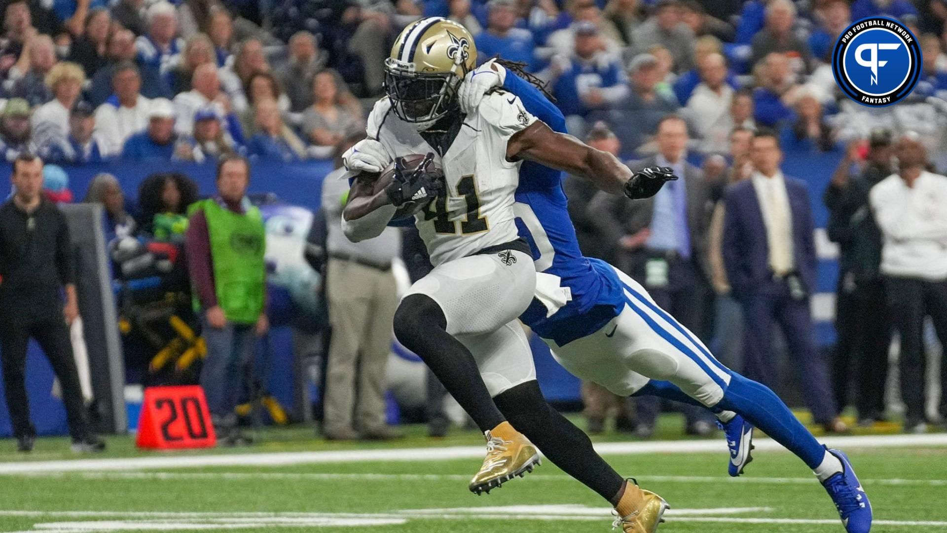 Indianapolis Colts cornerback Jaylon Jones (40) hangs onto New Orleans Saints running back Alvin Kamara (41) as he runs in a touchdown