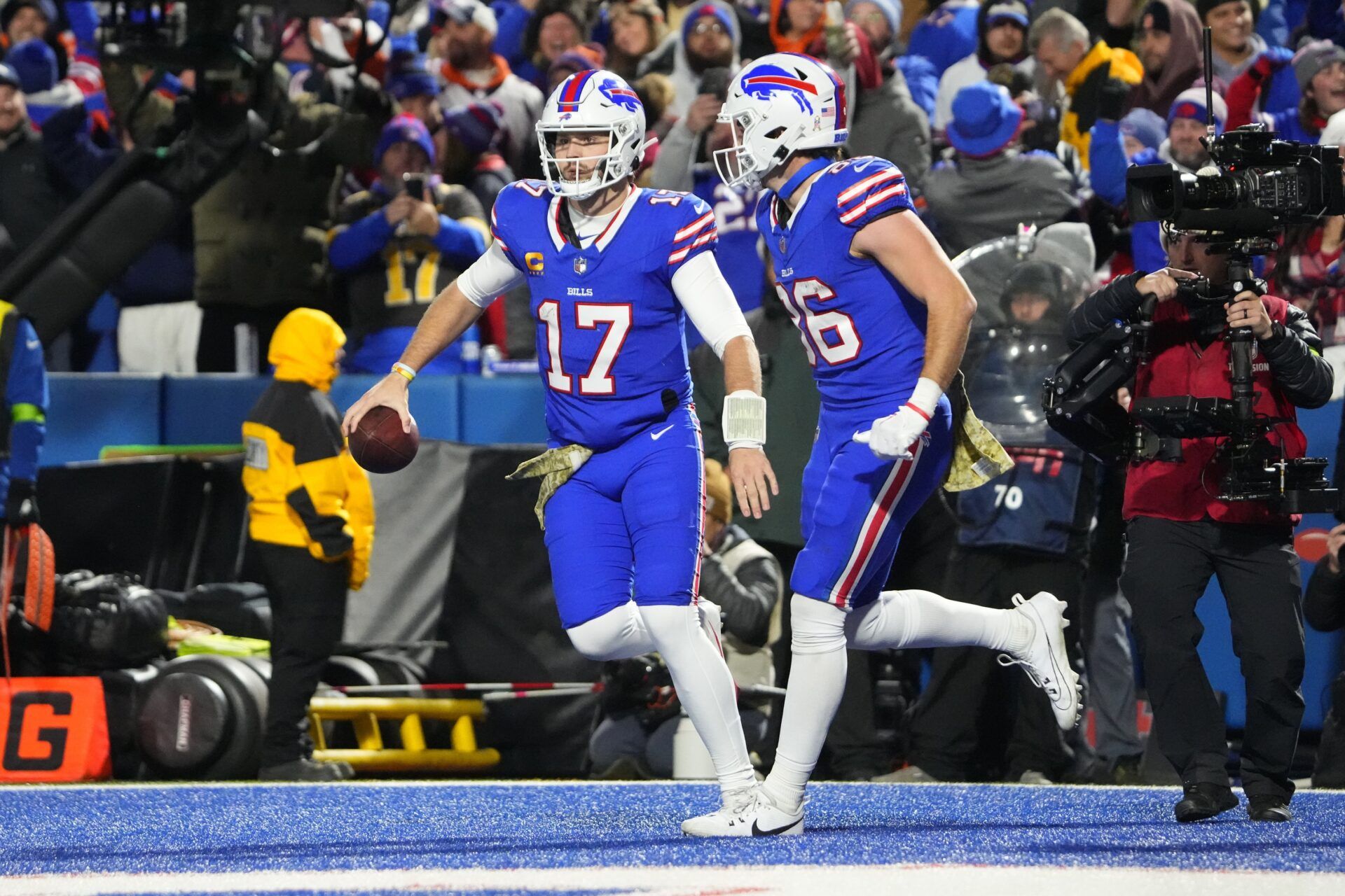 Buffalo Bills QB Josh Allen (17) and TE Dalton Kincaid (86) celebrate after a touchdown.