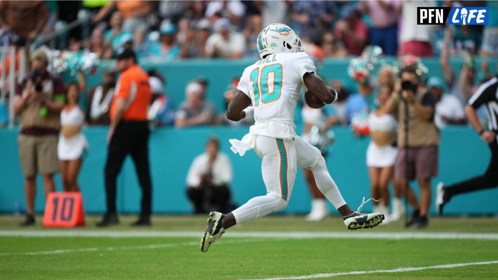 Miami Dolphins wide receiver Tyreek Hill (10) scores a touchdown against the Las Vegas Raiders during the first half at Hard Rock Stadium.