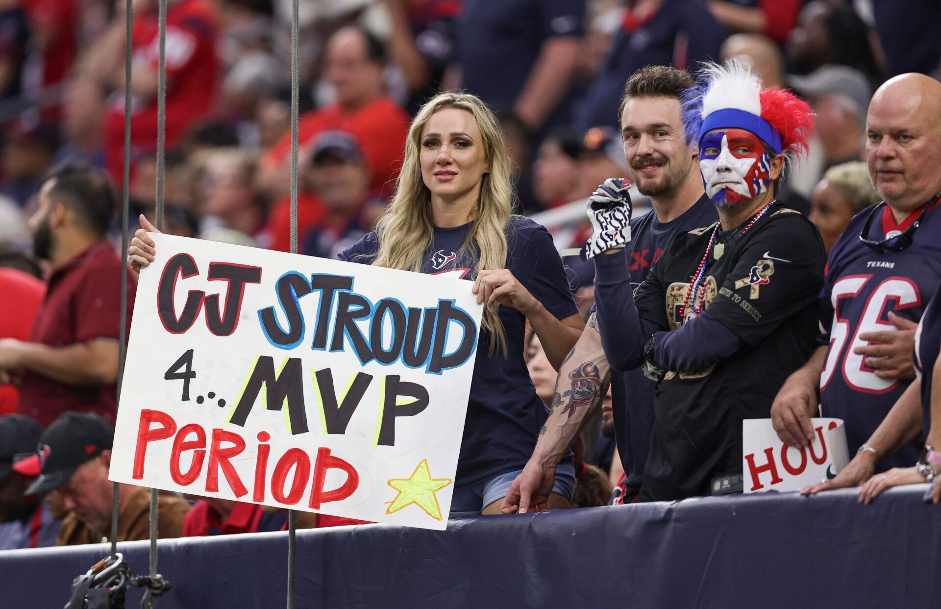 A fan holds a sign for Houston Texans quarterback C.J. Stroud (not pictured) during the fourth quarter of the game against the Arizona Cardinals at NRG Stadium.