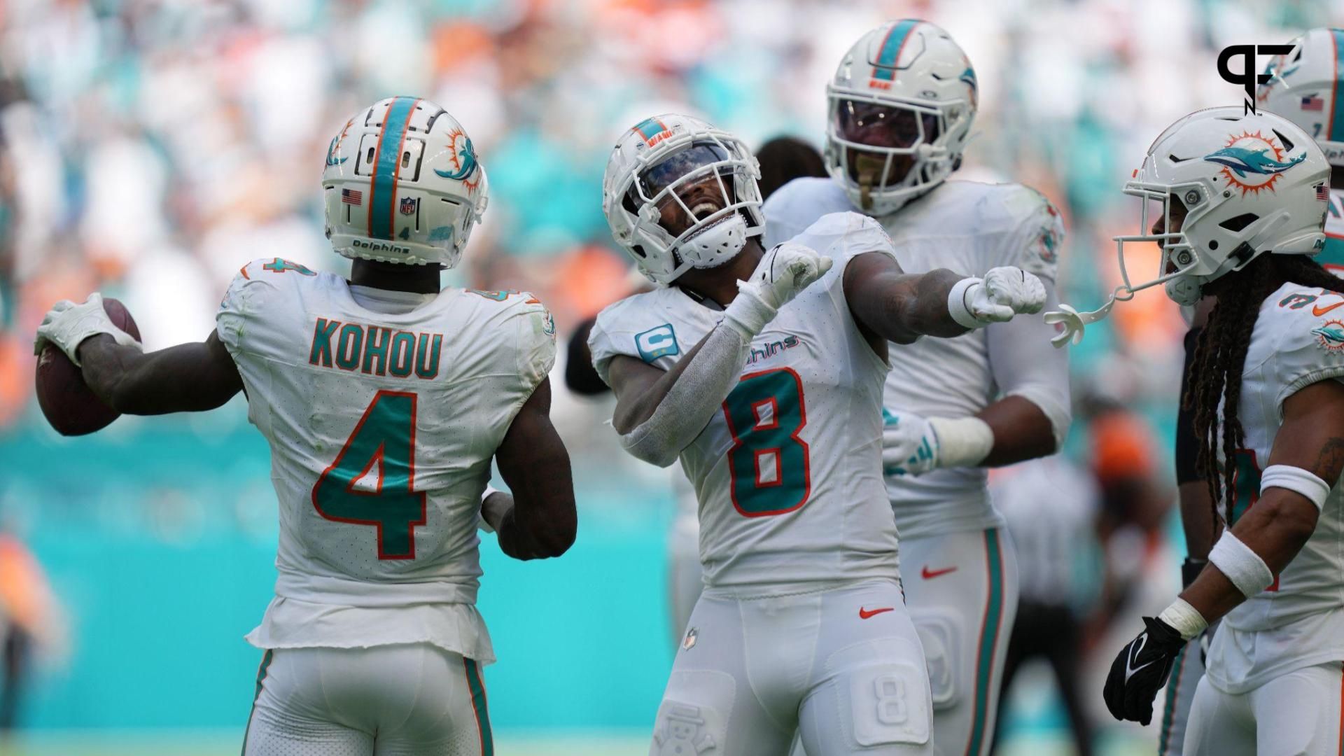 Miami Dolphins safety Jevon Holland (8) celebrates creating a turnover against the Denver Broncos that was recovered by cornerback Kader Kohou (4) during the second half of an NFL game at Hard Rock Stadium in Miami Gardens, Sept. 24, 2023.