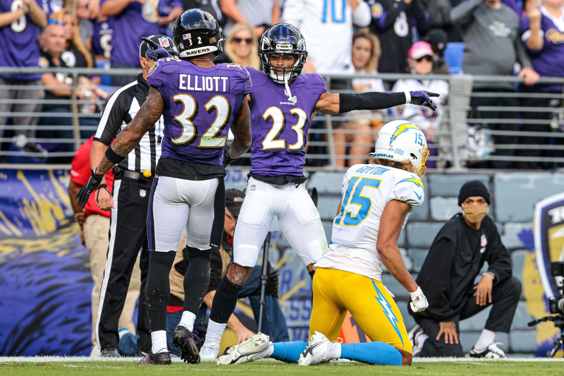 Baltimore Ravens cornerback Anthony Averett (23) celebrates a defensive stop with free safety DeShon Elliott (32) against Los Angeles Chargers wide receiver Jalen Guyton (15) during the second half at M&T Bank Stadium.