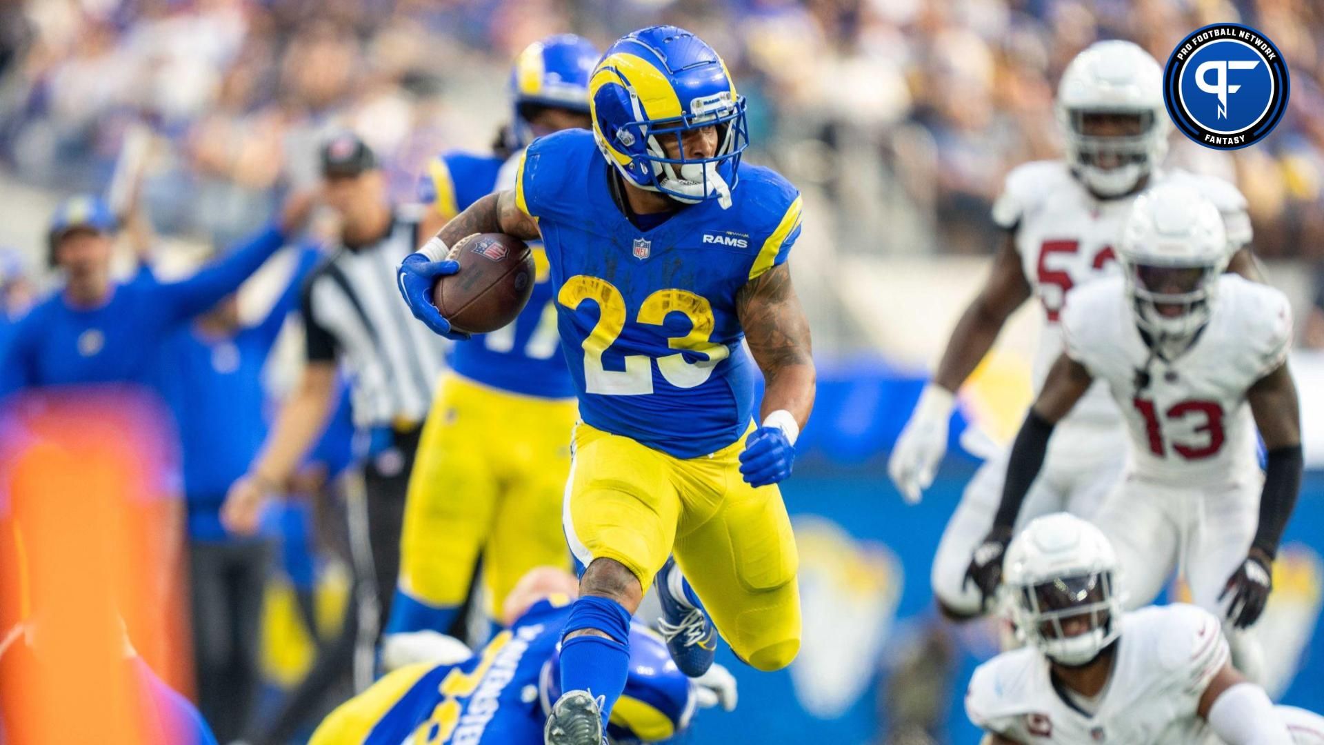 Kyren Williams (23) runs the football during the third quarter against the Arizona Cardinals at SoFi Stadium.