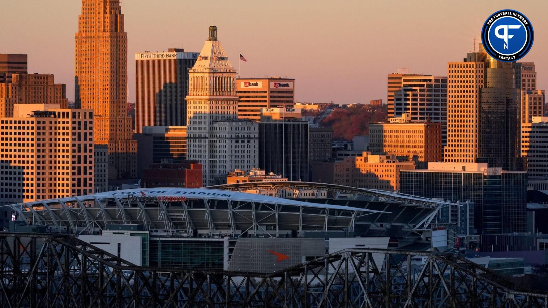 The sun sets over Paycor Stadium in Downtown Cincinnati on Saturday, Nov. 18, 2023, as seen from the Scenic Overlook at Devou Park in Covington, Ky.