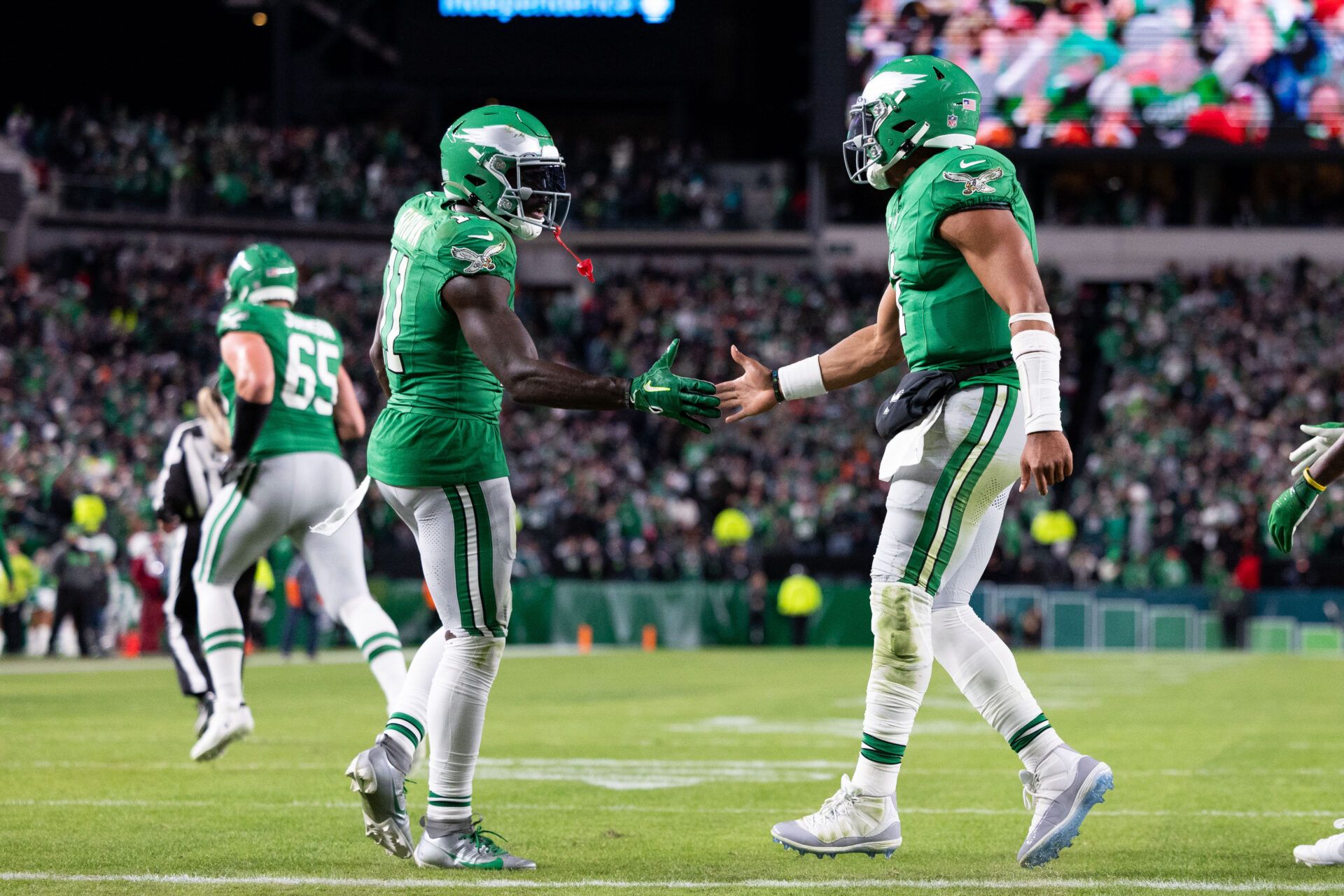 Philadelphia Eagles quarterback Jalen Hurts (1) and wide receiver A.J. Brown (11) shake hands after a touchdown drive against the Miami Dolphins during the fourth quarter at Lincoln Financial Field.