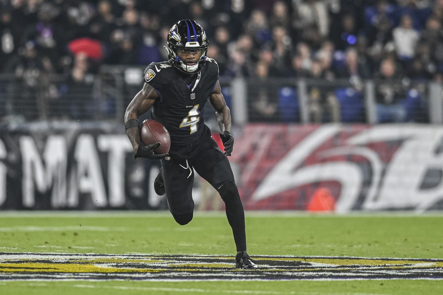 Baltimore Ravens wide receiver Zay Flowers (4) runs after a first half catch against the Cincinnati Bengals at M&T Bank Stadium.