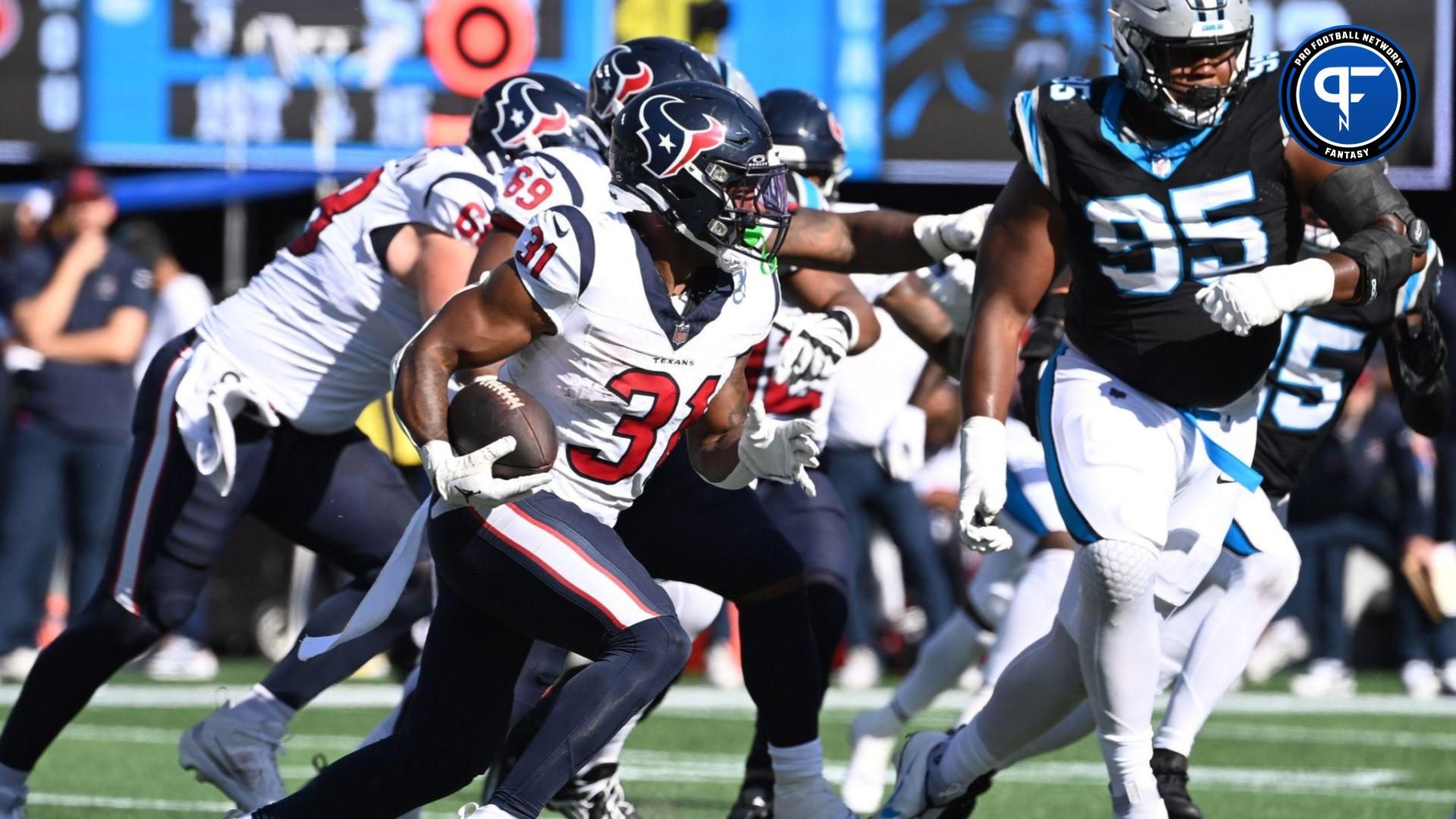 Houston Texans running back Dameon Pierce (31) runs in the third quarter at Bank of America Stadium.