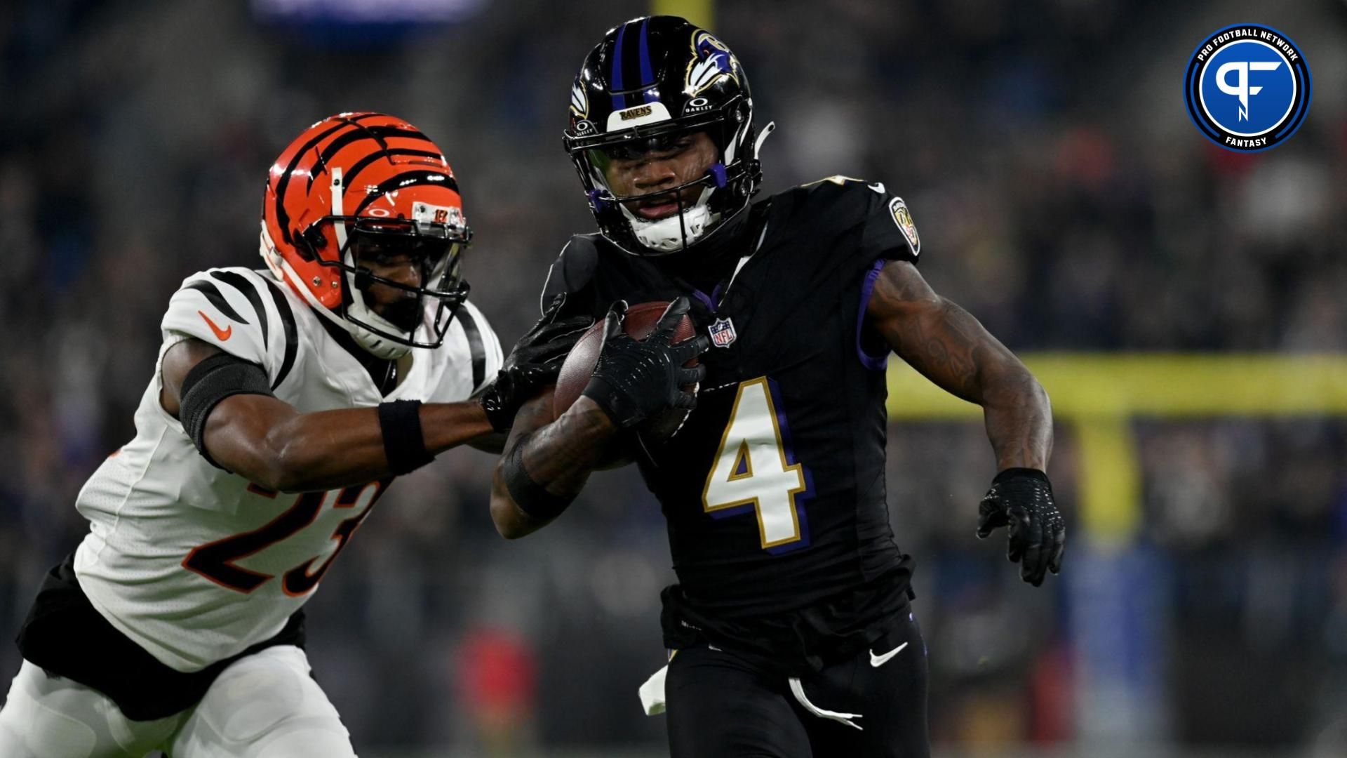 Baltimore Ravens wide receiver Zay Flowers (4) runs against Cincinnati Bengals safety Dax Hill (23) during the first quarter at M&T Bank Stadium.