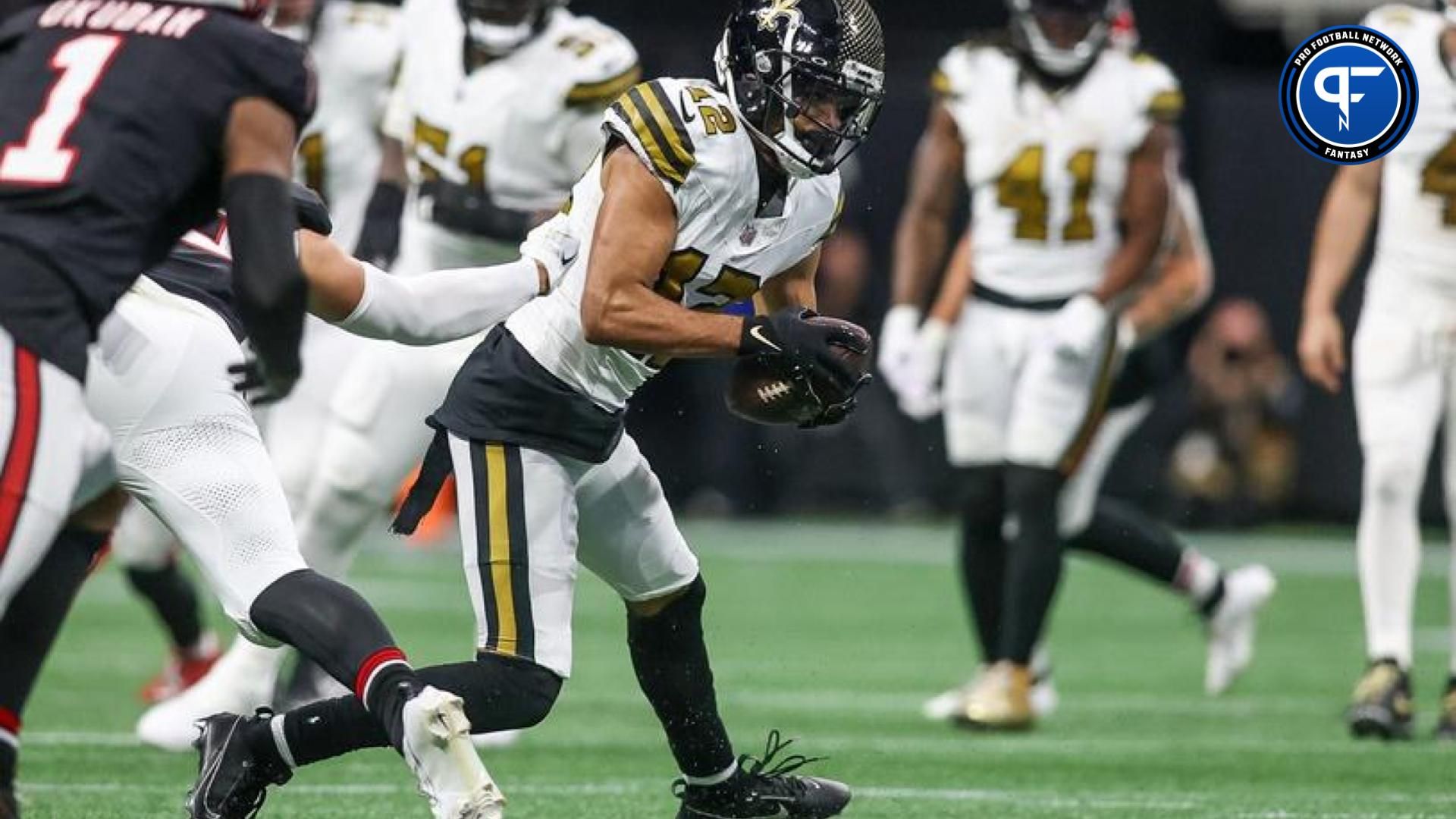 New Orleans Saints wide receiver Chris Olave (12) runs after a catch against the Atlanta Falcons in the second quarter at Mercedes-Benz Stadium.