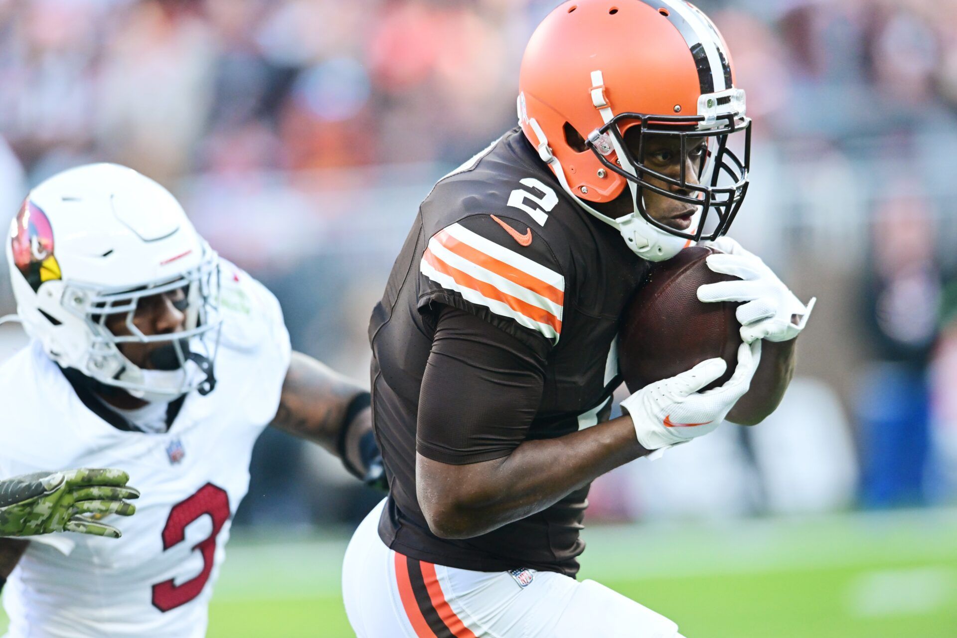 Cleveland Browns wide receiver Amari Cooper (2) runs with the ball after a catch as Arizona Cardinals safety Budda Baker (3) defends during the second half at Cleveland Browns Stadium.