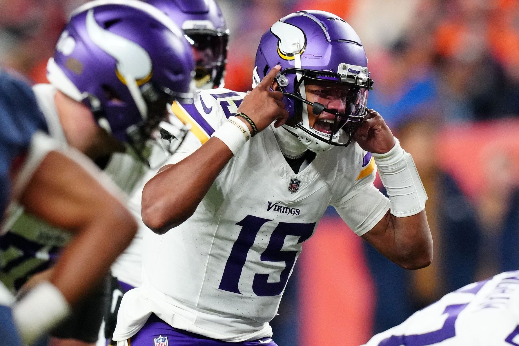 Minnesota Vikings QB Joshua Dobbs (15) calls out a play against the Denver Broncos.