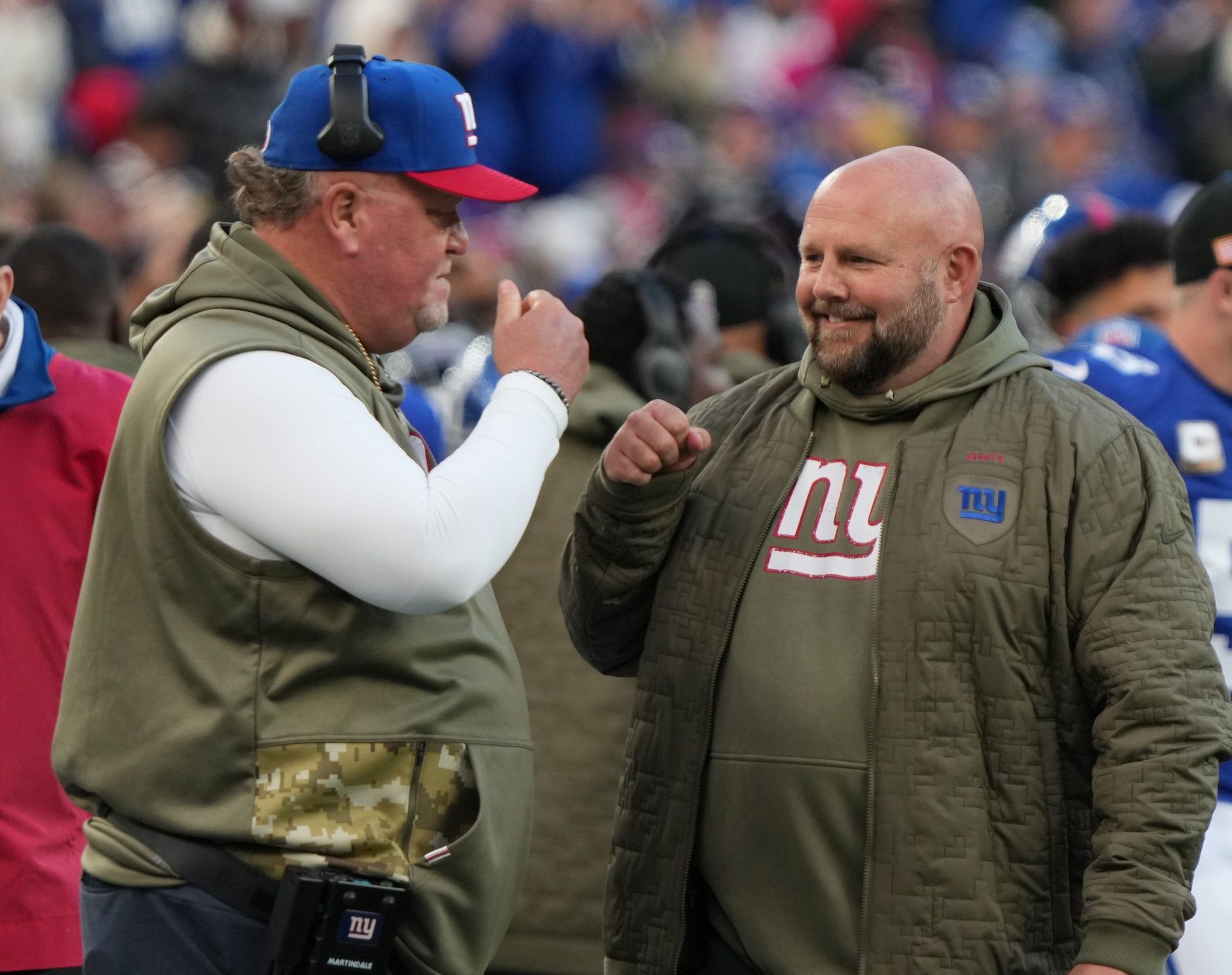 New York Giants defensive coordinator Wink Martindale and head coach Brian Daboll discussing on the sidelines.