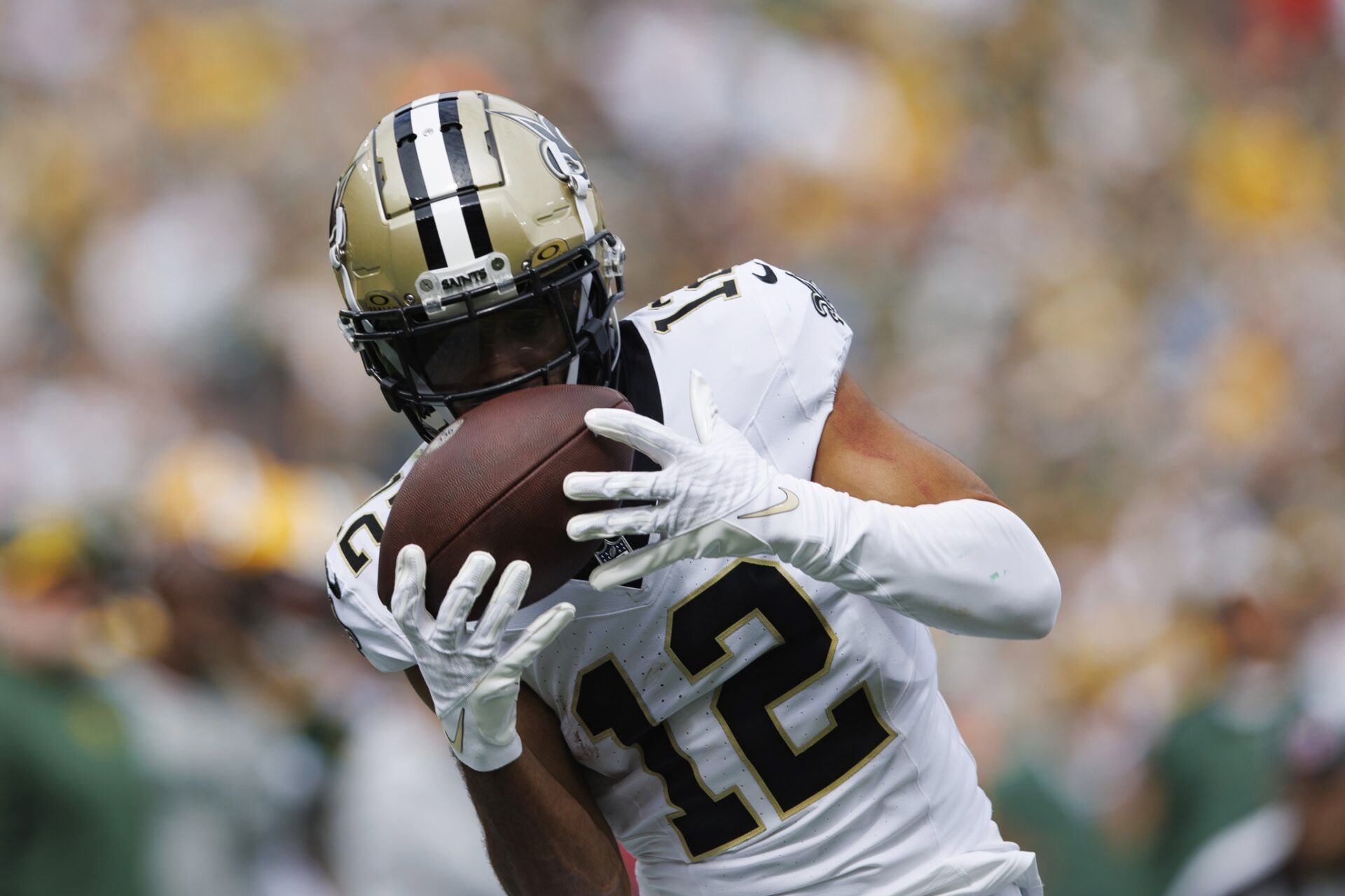 New Orleans Saints WR Chris Olave (12) catches a pass against the Green Bay Packers.