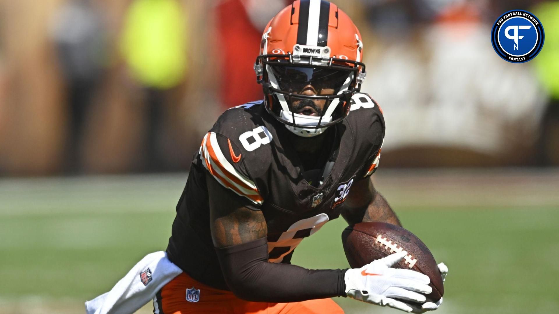 Cleveland Browns wide receiver Elijah Moore (8) runs with the ball in the first quarter against the Baltimore Ravens at Cleveland Browns Stadium.