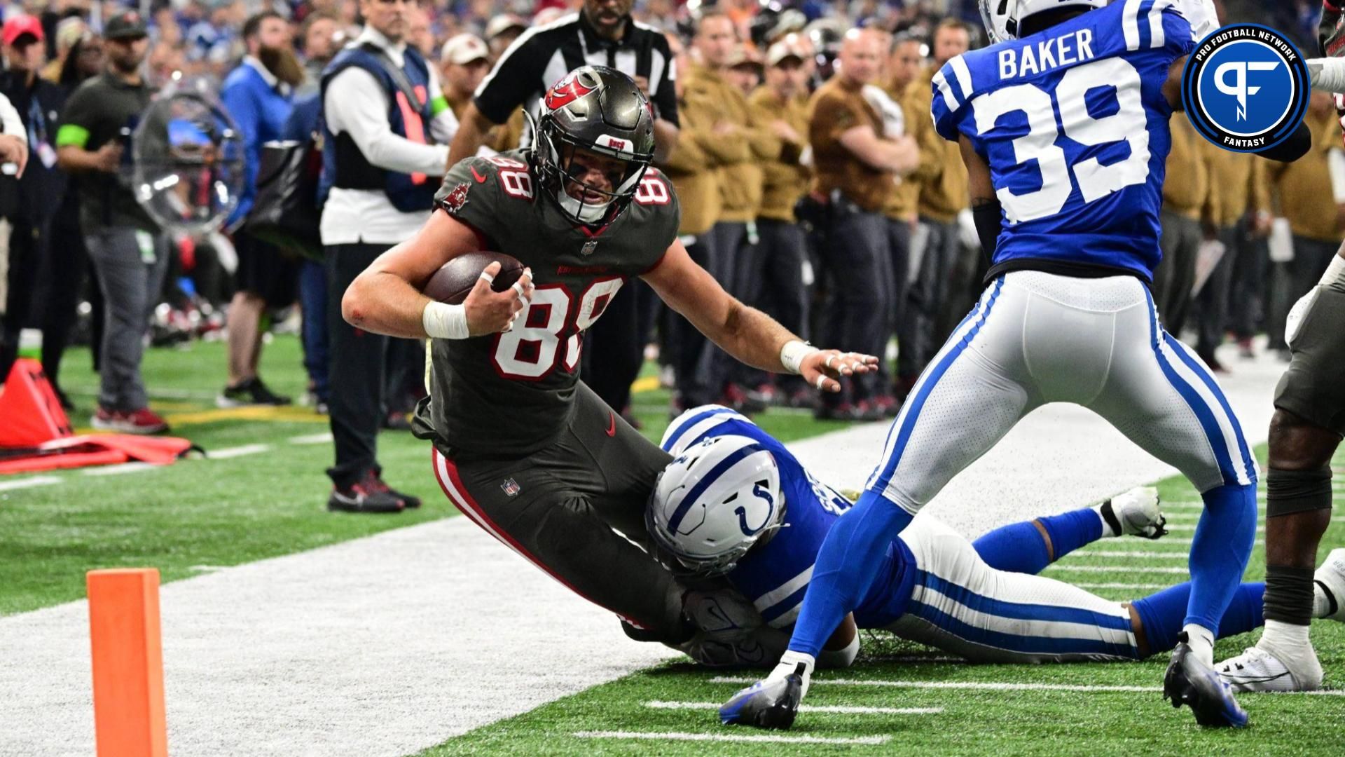 Tampa Bay Buccaneers tight end Cade Otton (88) is tackled by Indianapolis Colts linebacker E.J. Speed (45) short of the end zone during the second half at Lucas Oil Stadium.