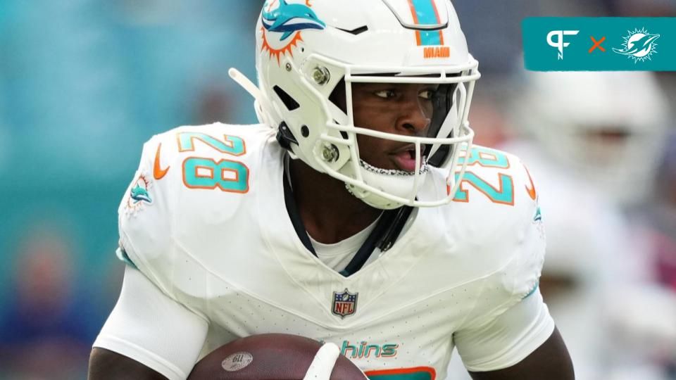 De'Von Achane (28) runs with the ball against the Las Vegas Raiders during the first half at Hard Rock Stadium.