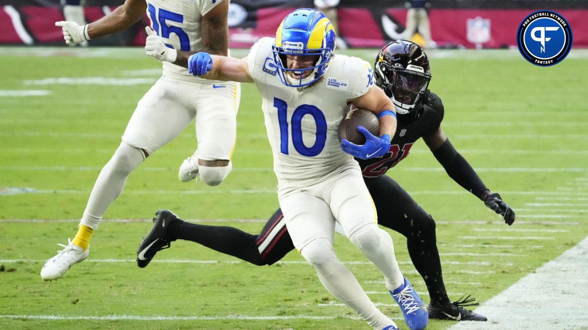 Los Angeles Rams wide receiver Cooper Kupp (10) carries the ball against the Arizona Cardinals in the first half at State Farm Stadium in Glendale on Nov. 26, 2023.