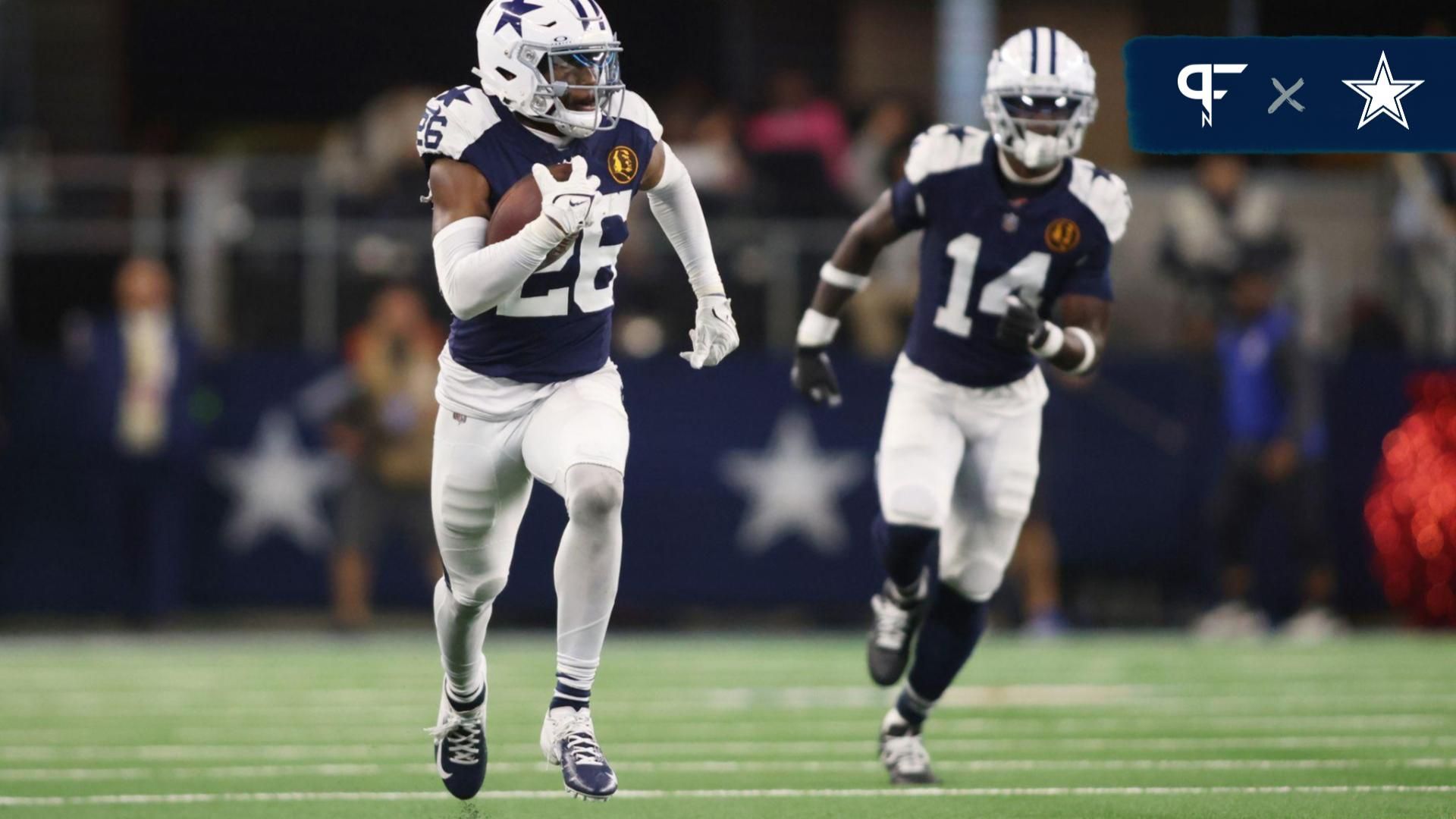 Dallas Cowboys CB DaRon Bland (26) returns an interception for a touchdown in the fourth quarter against the Washington Commanders.