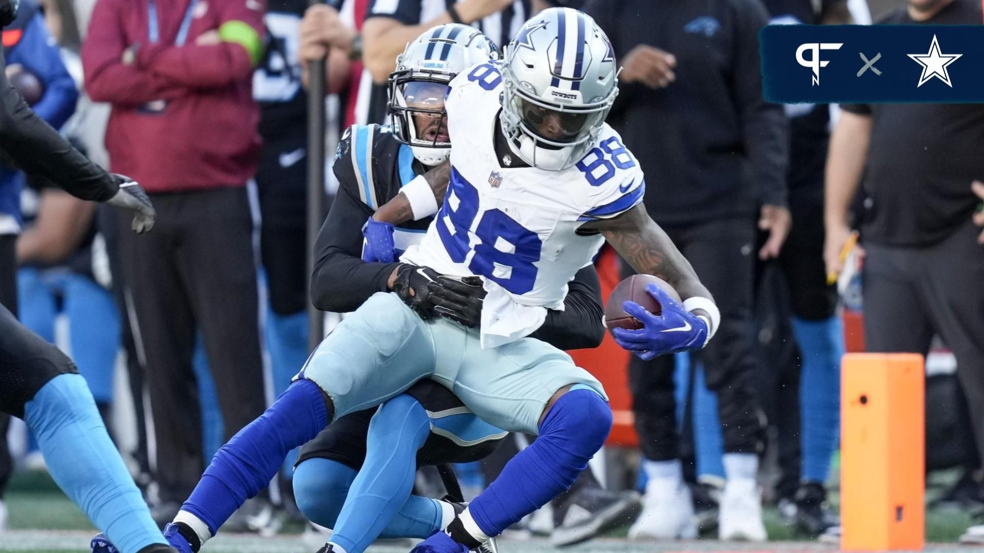 Dallas Cowboys wide receiver CeeDee Lamb (88) is hit as he makes a catch by Carolina Panthers safety Vonn Bell (24) during the second half at Bank of America Stadium.