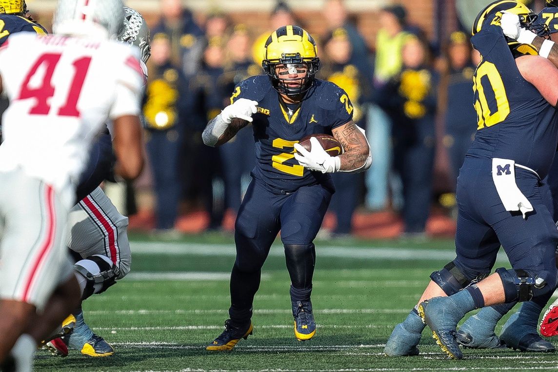 Michigan running back Blake Corum (2) runs against Ohio State during the second half at Michigan Stadium in Ann Arbor on Saturday, Nov. 25, 2023.