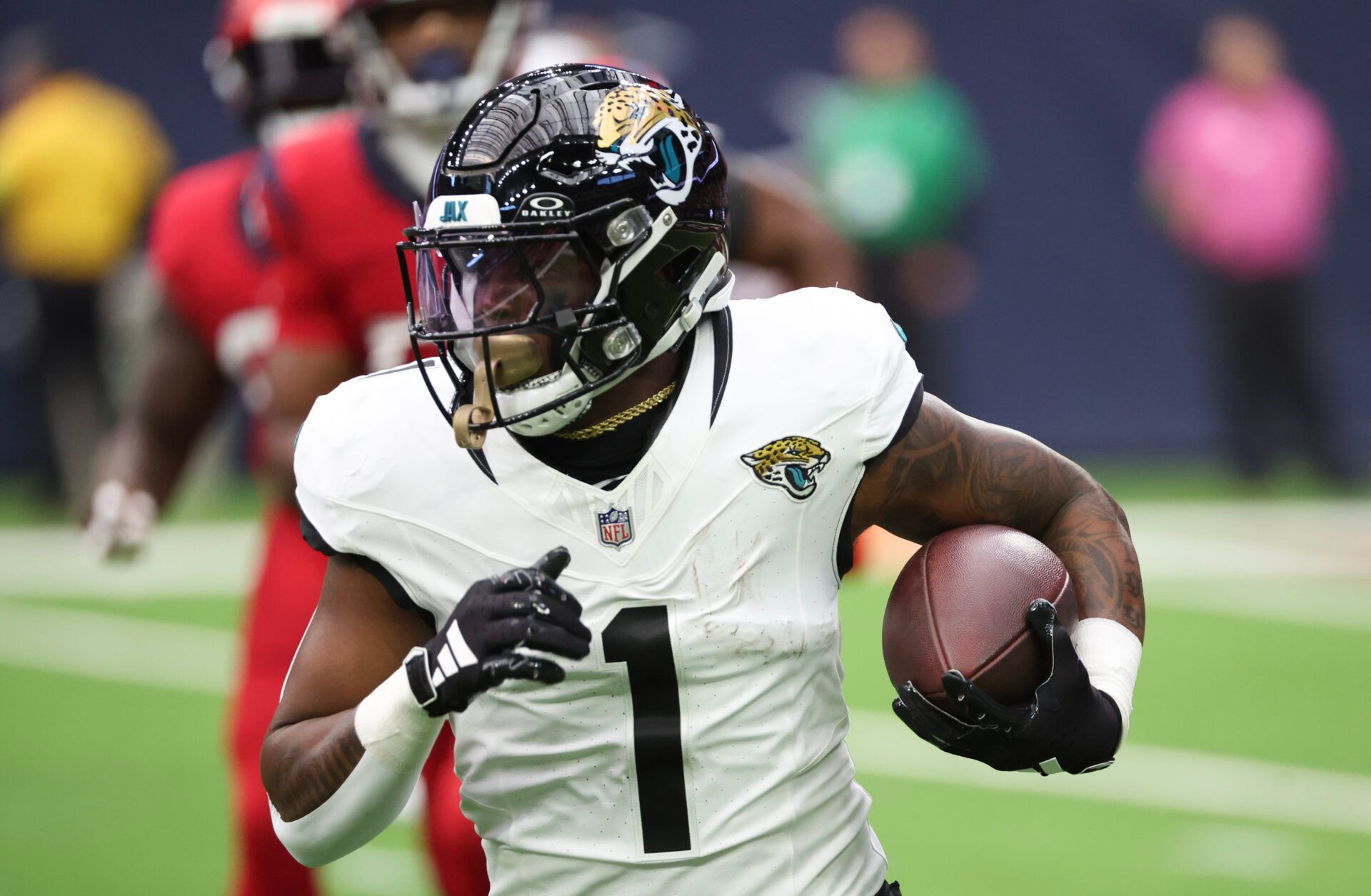 Jacksonville Jaguars running back Travis Etienne Jr. (1) rushes against the Houston Texans in the first quarter at NRG Stadium.