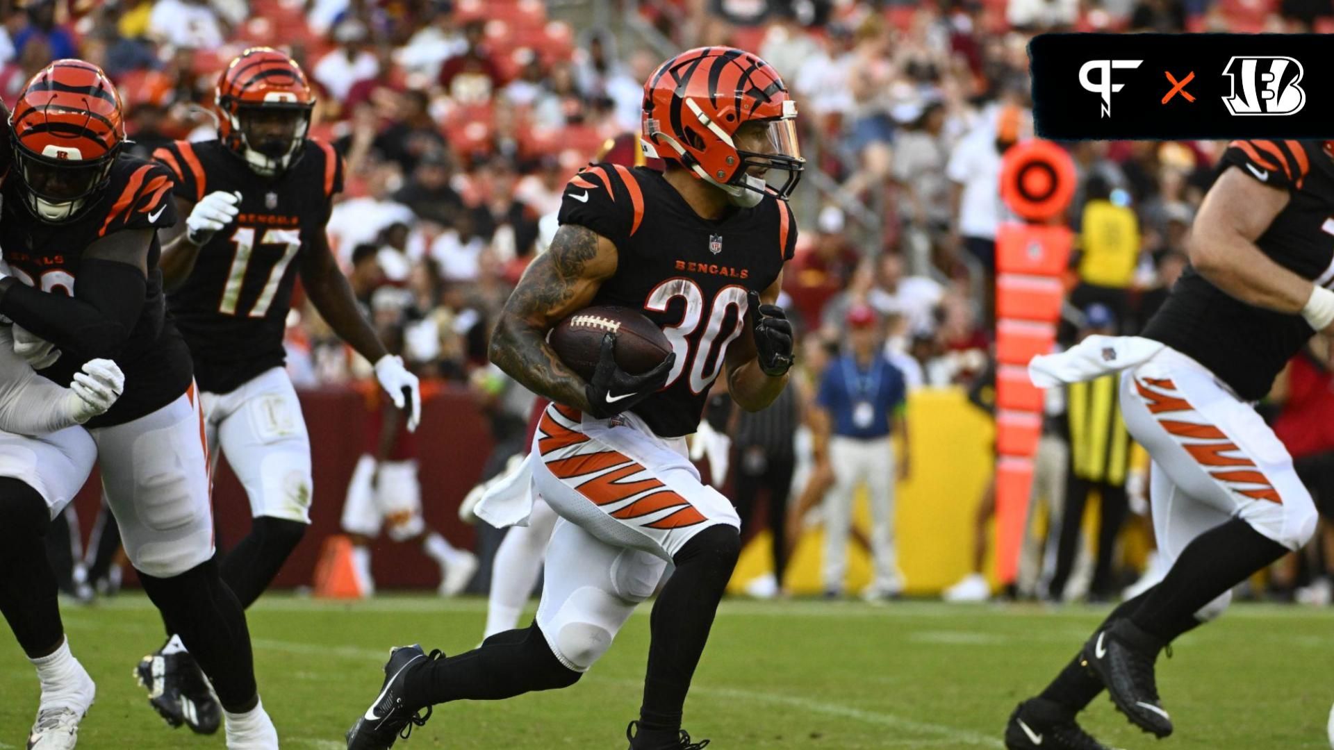 Chase Brown (30) carries the ball against the Washington Commanders during the first half at FedExField.