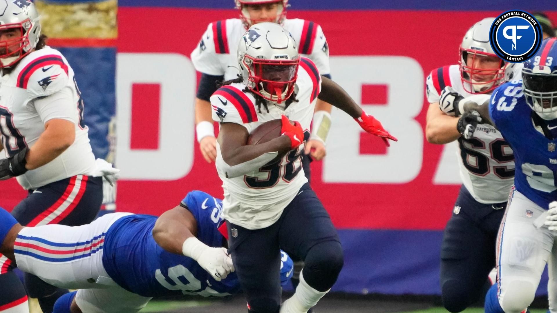 Rhamondre Stevenson (38) breaks out for a 1st down run against the New York Giants in the 1st half at MetLife Stadium.