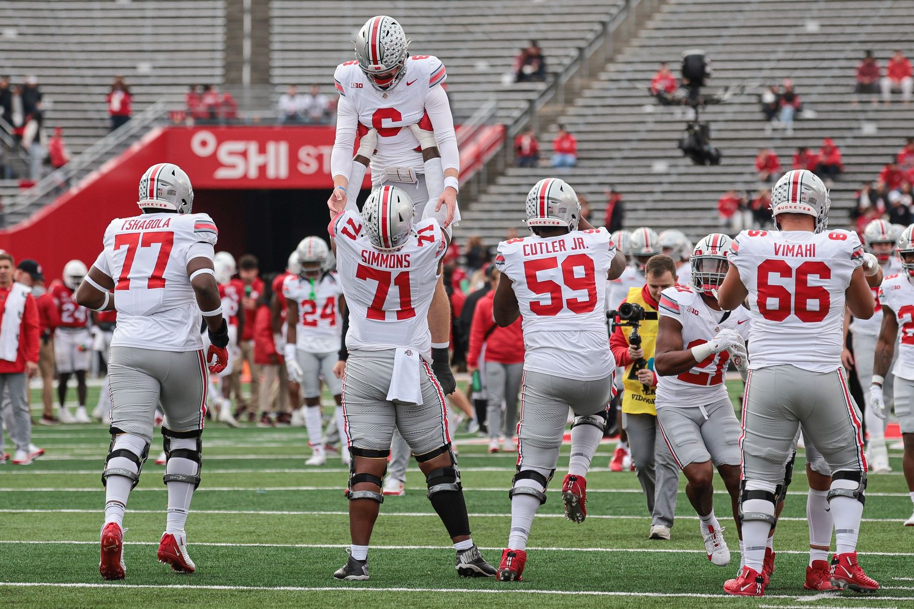 Ohio State Buckeyes offensive lineman Josh Simmons (71) and quarterback Kyle McCord (6) prepare for the game against the Rutgers Scarlet Knights at SHI Stadium.