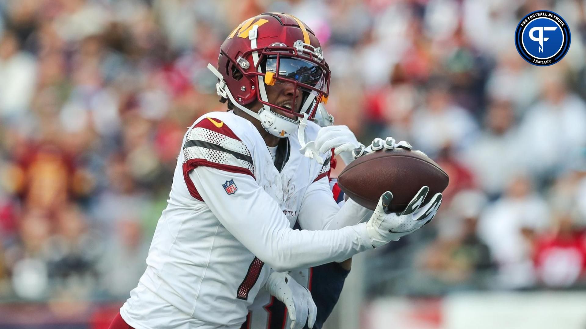 Jahan Dotson (1) catches a pass for a touchdown during the second half against the New England Patriots at Gillette Stadium.