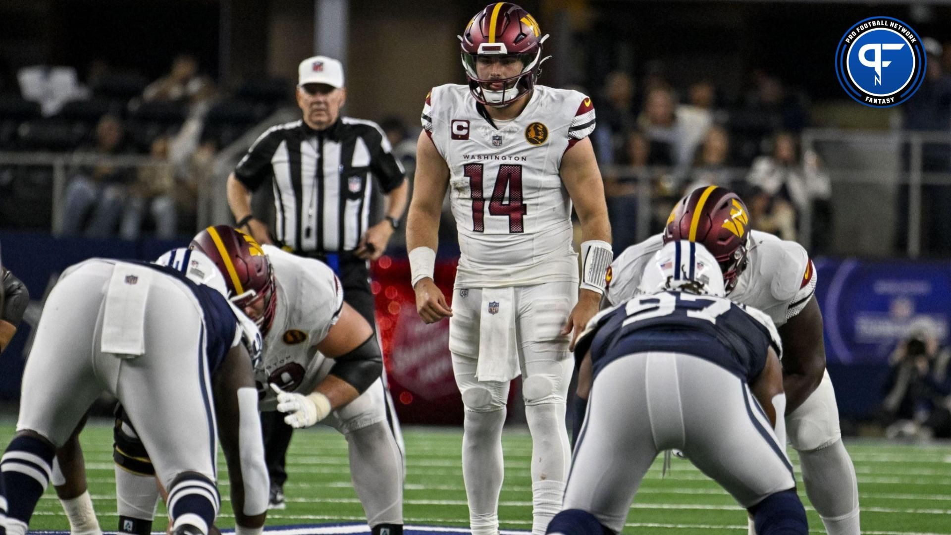 Washington Commanders quarterback Sam Howell (14) in action during the game between the Dallas Cowboys and the Washington Commanders.