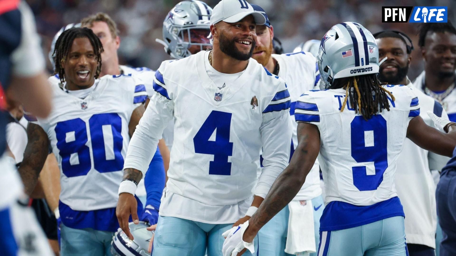 Dallas Cowboys quarterback Dak Prescott (4) laughs with teammates after a touchdown during the second quarter against the Jacksonville Jaguars at AT&T Stadium.