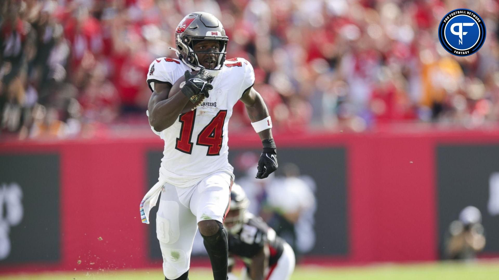 Tampa Bay Buccaneers wide receiver Chris Godwin (14) runs with the ball against the Atlanta Falcon in the fourth quarter at Raymond James Stadium.