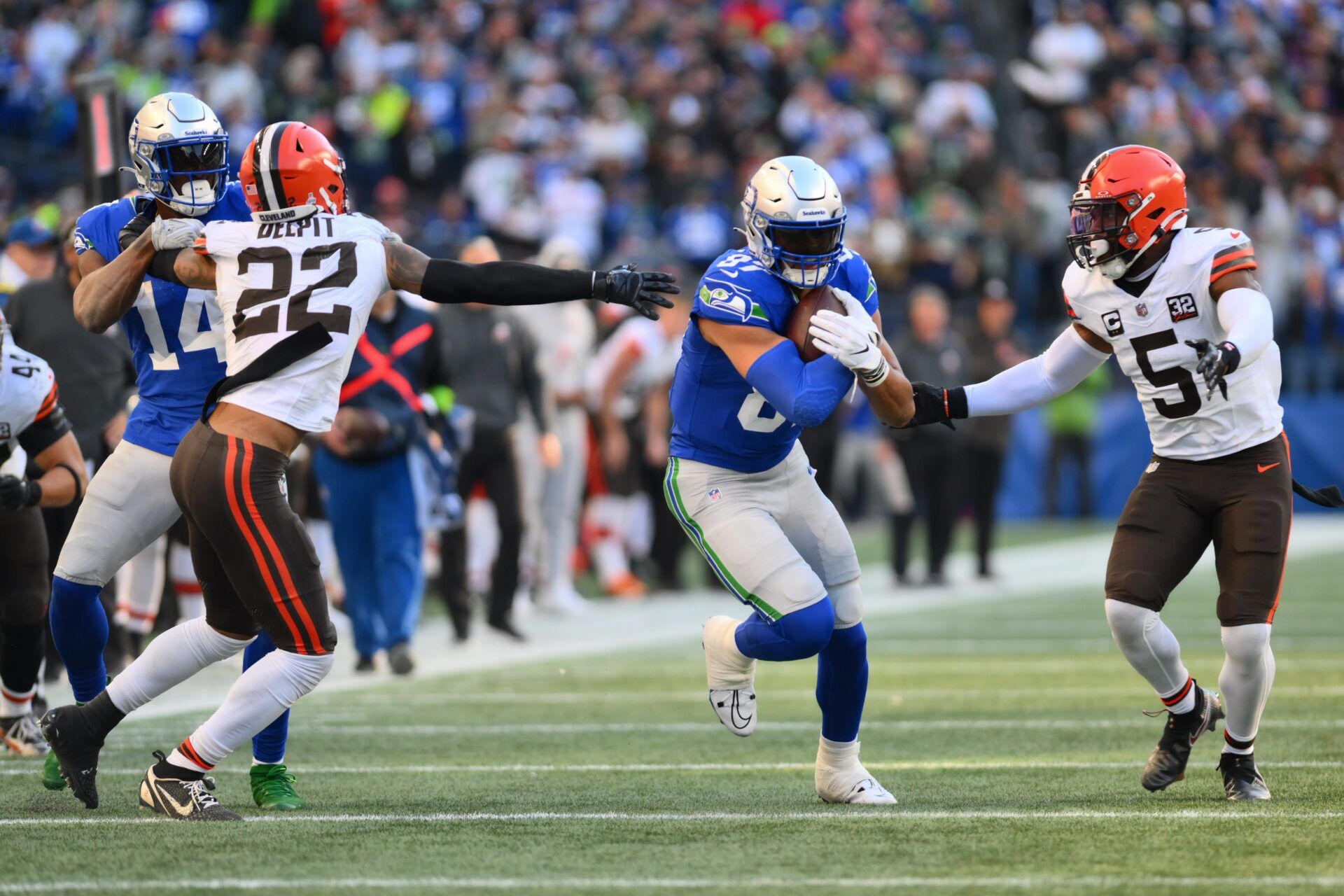 Seattle Seahawks tight end Noah Fant (87) carries the ball after a catch while wide receiver DK Metcalf (14) blocks Cleveland Browns safety Grant Delpit (22) during the second half at Lumen Field.