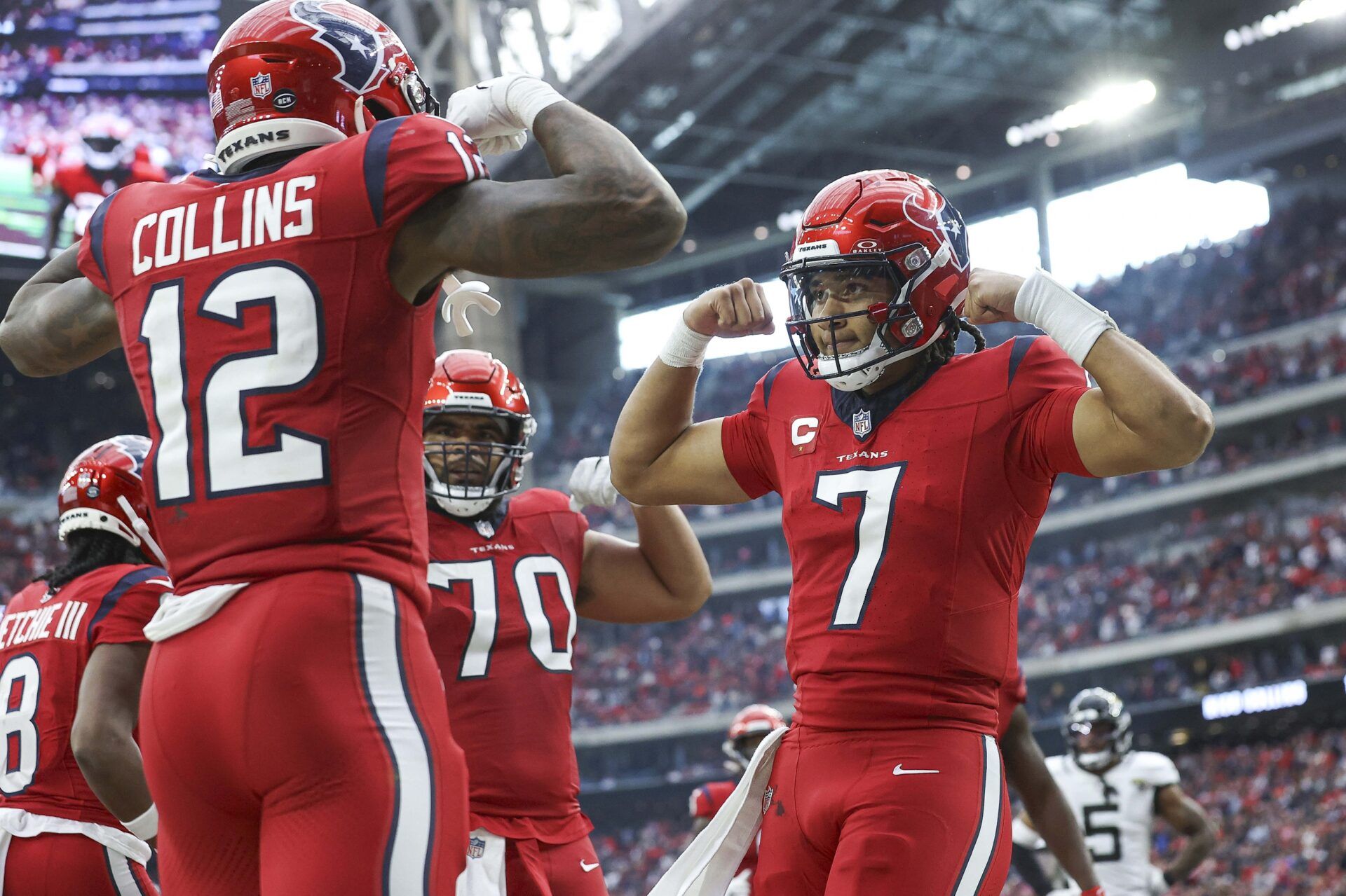 Houston Texans quarterback C.J. Stroud (7) celebrates with wide receiver Nico Collins (12) after a touchdown during the fourth quarter against the Jacksonville Jaguars at NRG Stadium.