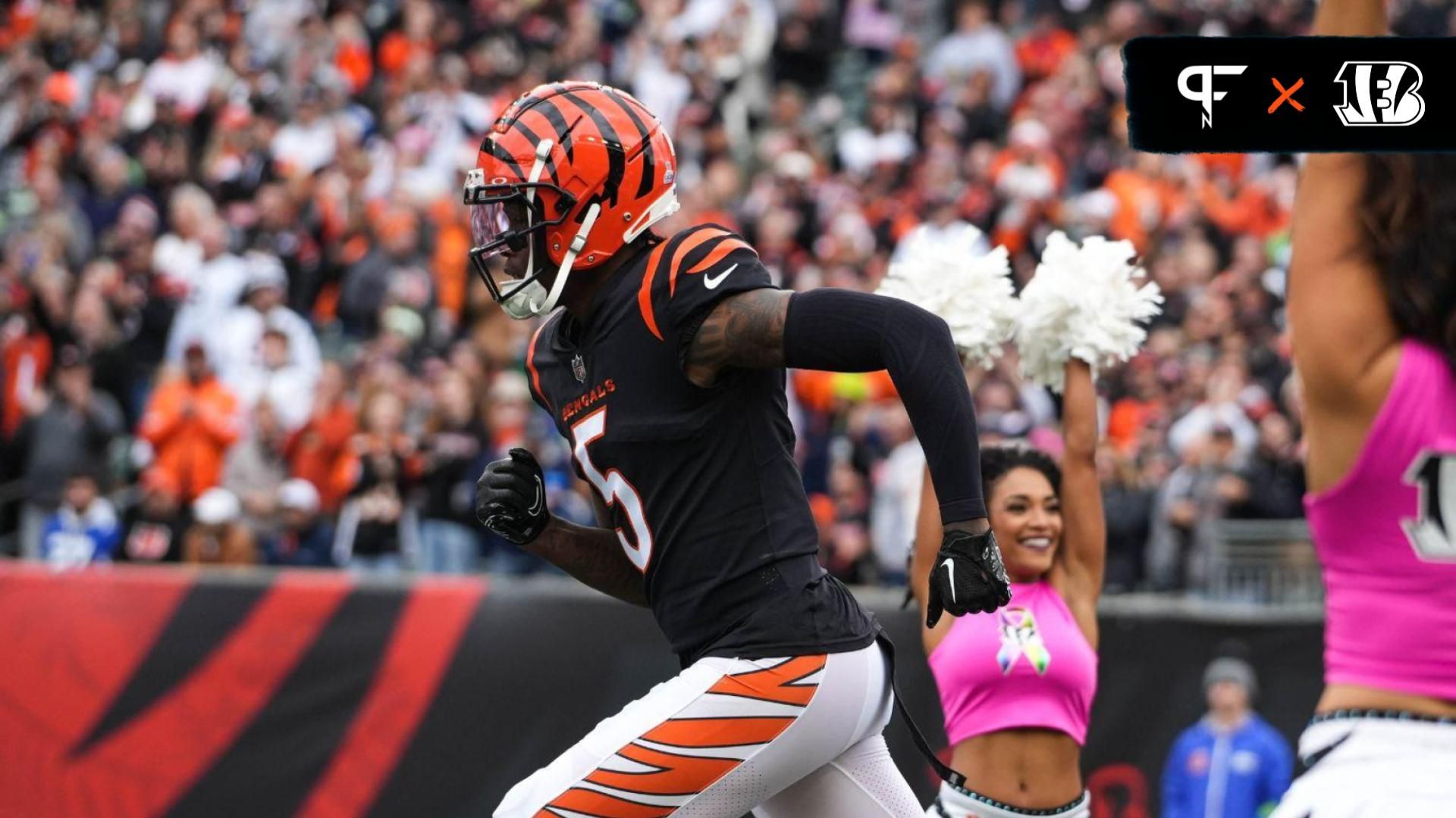 Tee Higgins (5) runs out to the field for their game against the Seattle Seahawks at Paycor Stadium.